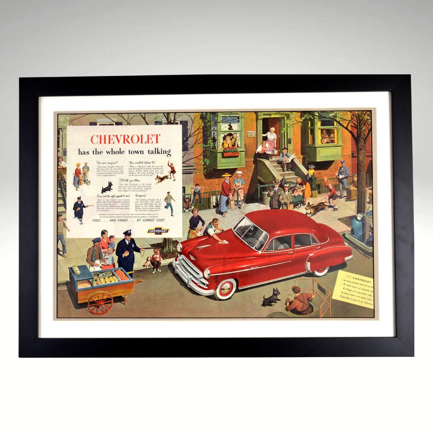 1950 Chevrolet Vintage Automotive Artwork – Framed 18x25 Classic Car Ad featuring a nostalgic city scene with a red Chevy, professionally framed for collectors and retro car lovers.