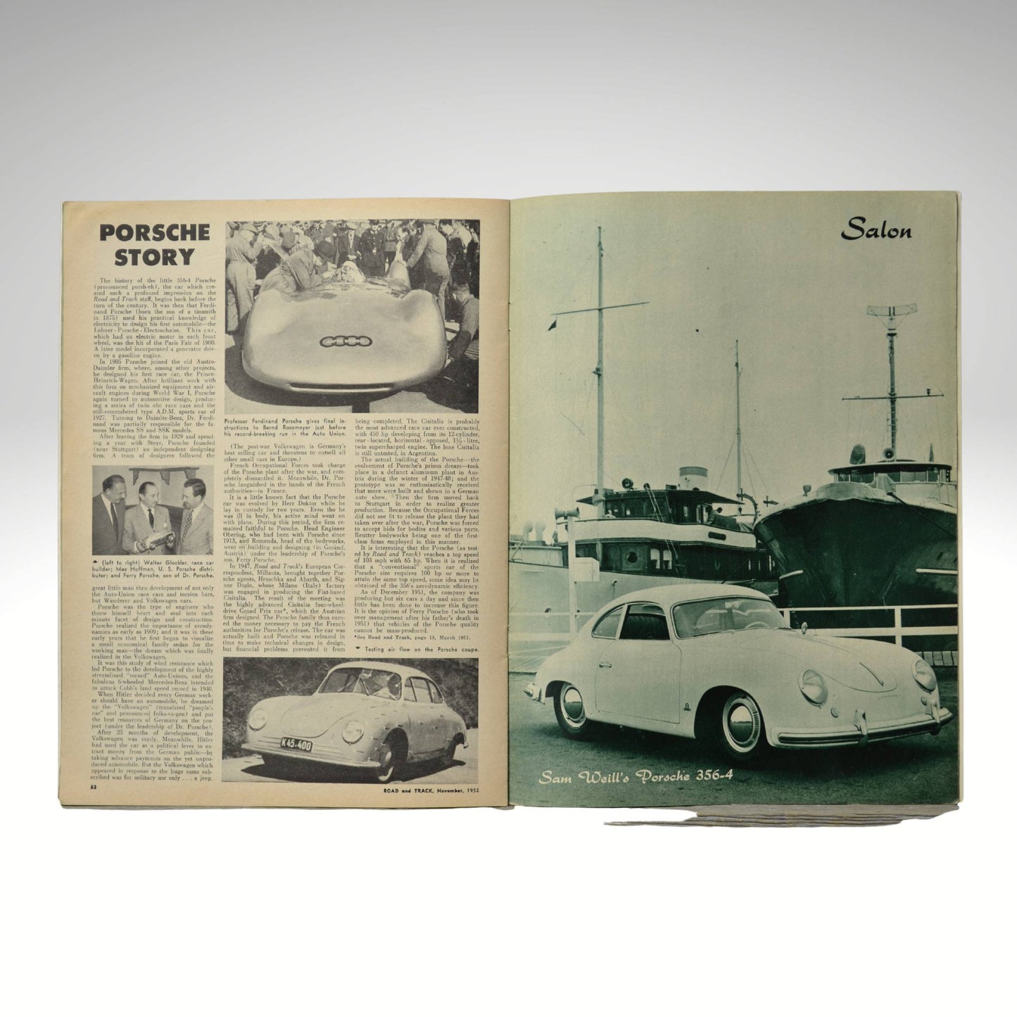 Open book showing vintage Porsche advertisements and images on a white background