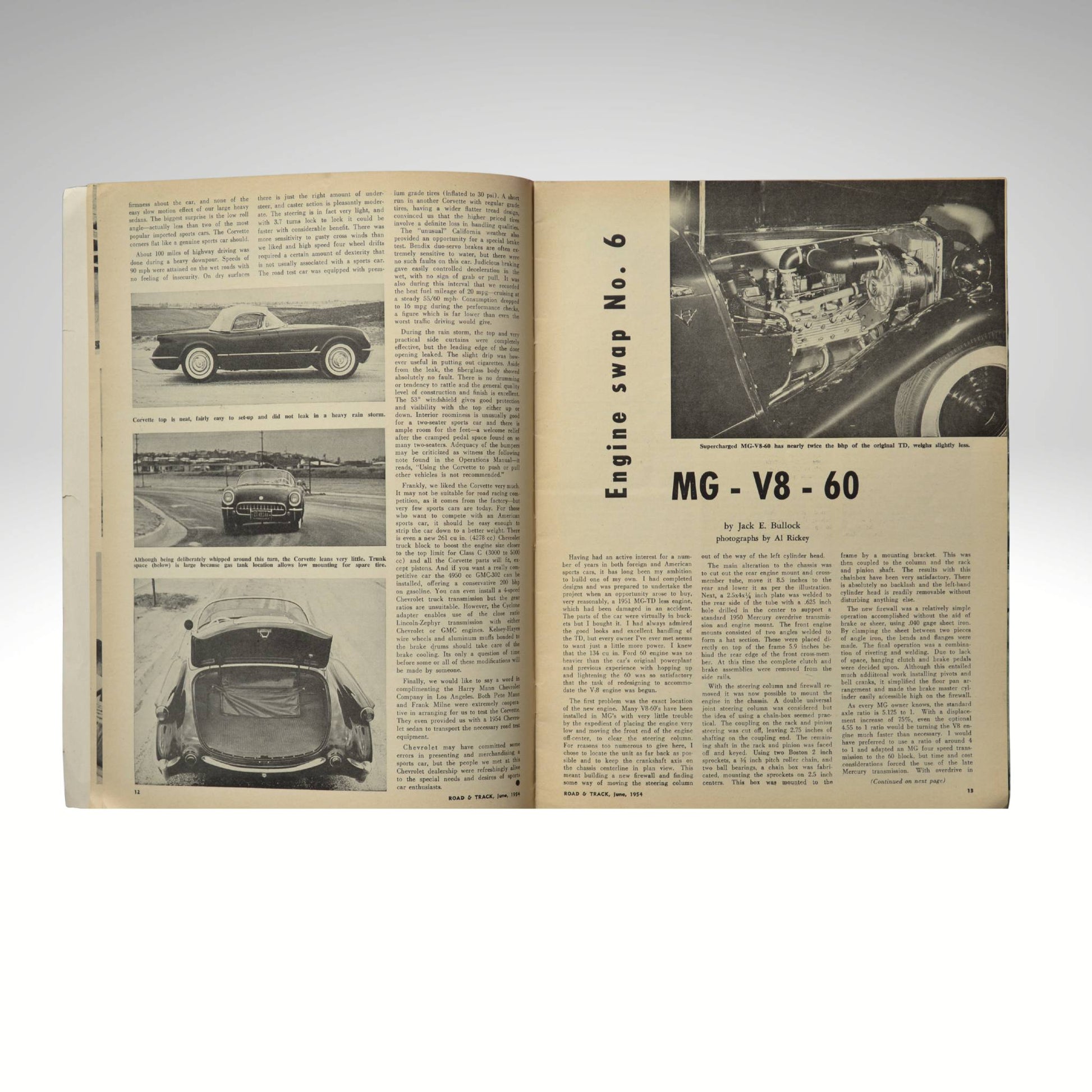 Open book with automotive content on a white background