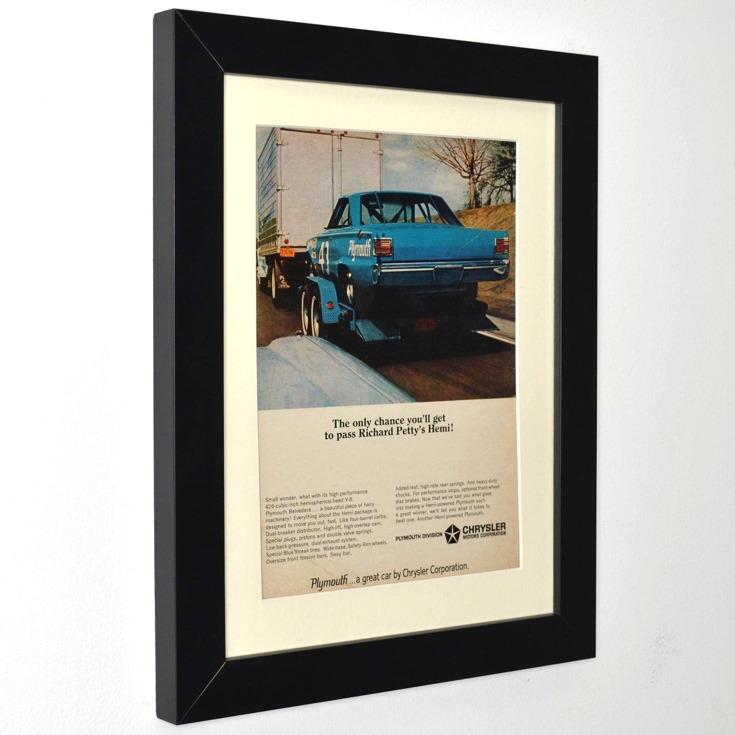 Framed 1966 Richard Petty HEMI Plymouth ad with race trailer – 12x15 vintage print wall art side view