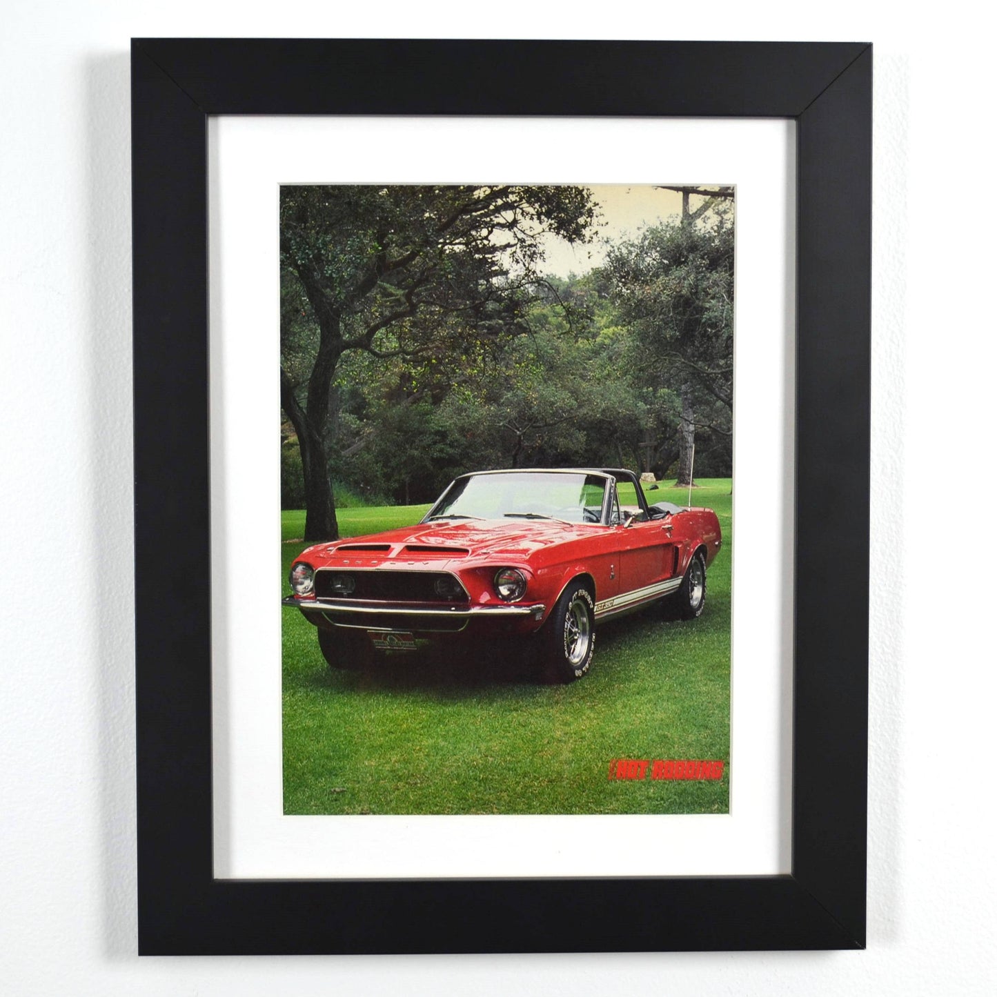 Framed 1968 Shelby GT-350 Convertible vintage print, featuring the red Shelby Mustang in a scenic setting, perfect for collectors and classic car enthusiasts.