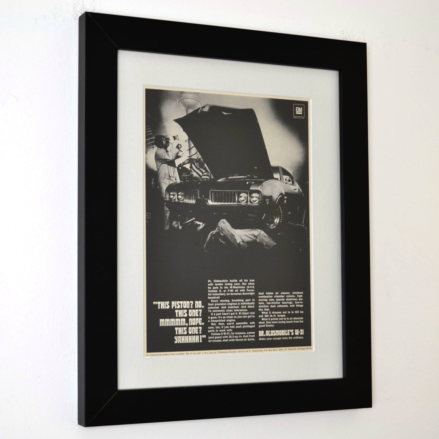 Side view of Framed 1969 Oldsmobile W-31 ad print with Dr. Oldsmobile inspecting pistons – 12x15 vintage car wall art