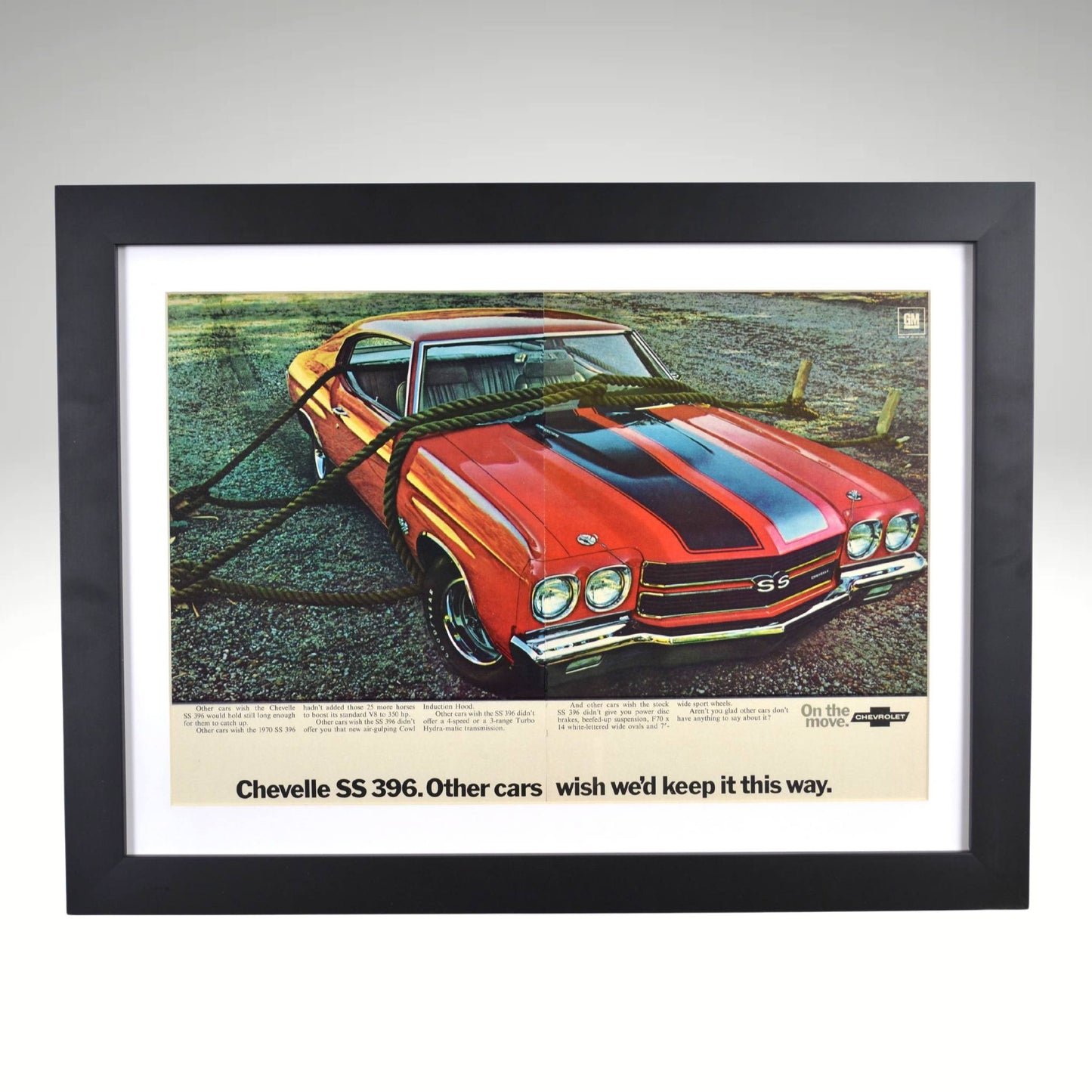 1970 Chevrolet Chevelle SS 396 framed vintage print ad featuring the Cowl Induction hood, SS badging, and classic muscle car styling, with authentic centerline misalignment and color shift.