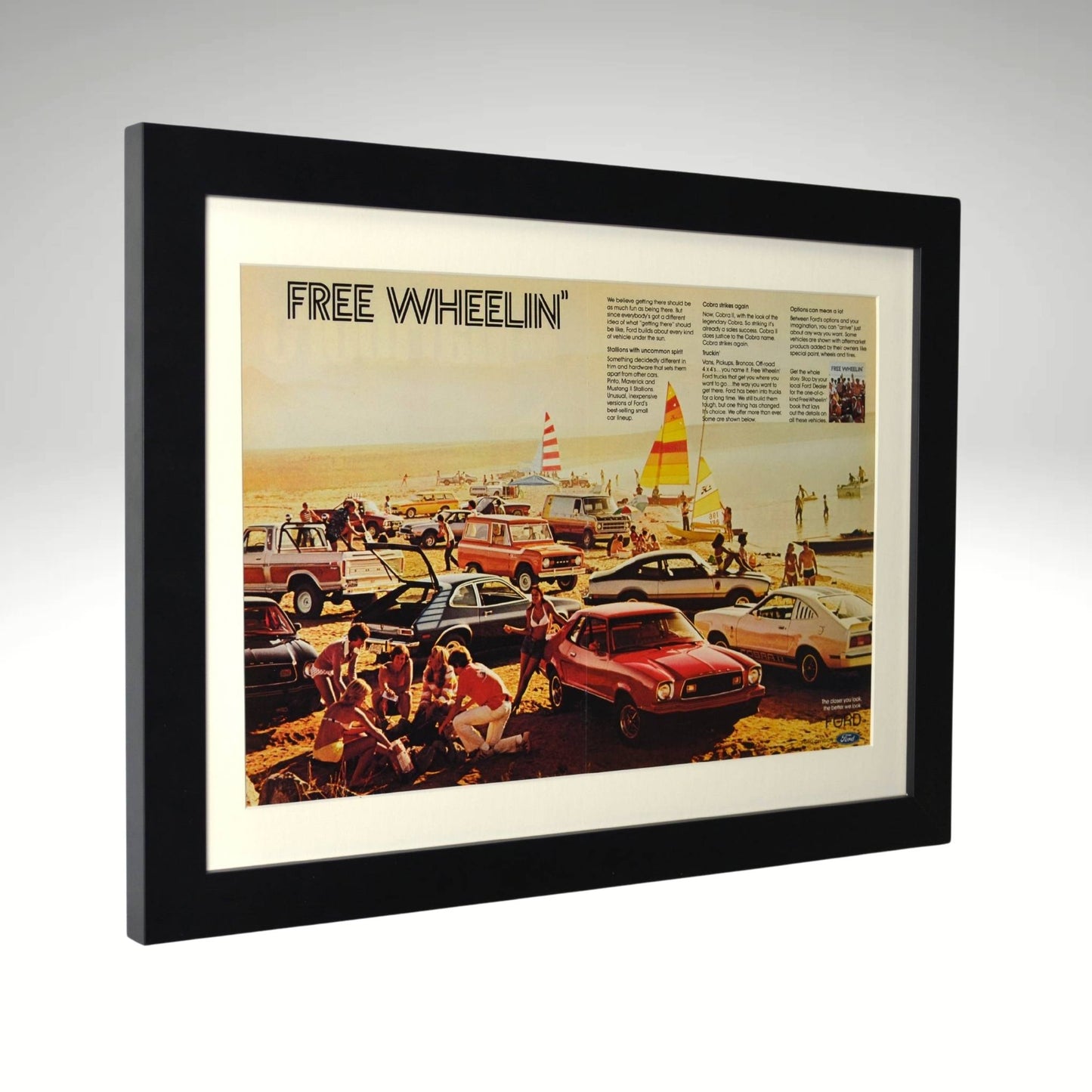 side view of 1970s Ford "Free Wheelin’" vintage print ad featuring classic Mustangs, Broncos, and custom vans in a retro beach scene.