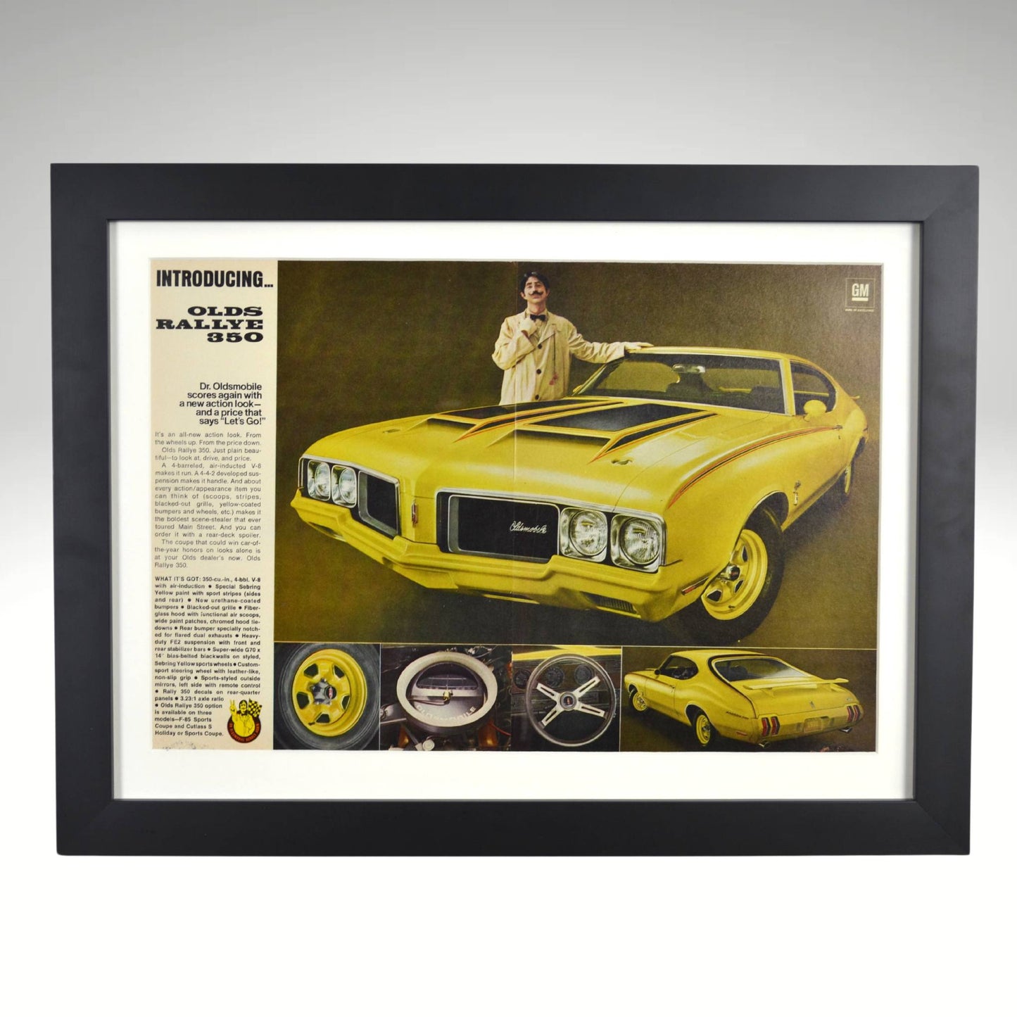 Framed vintage print of the 1970 Oldsmobile Rallye 350 with Dr. Olds, showcasing its bold Sebring Yellow design, black accents, and Rallye wheels.