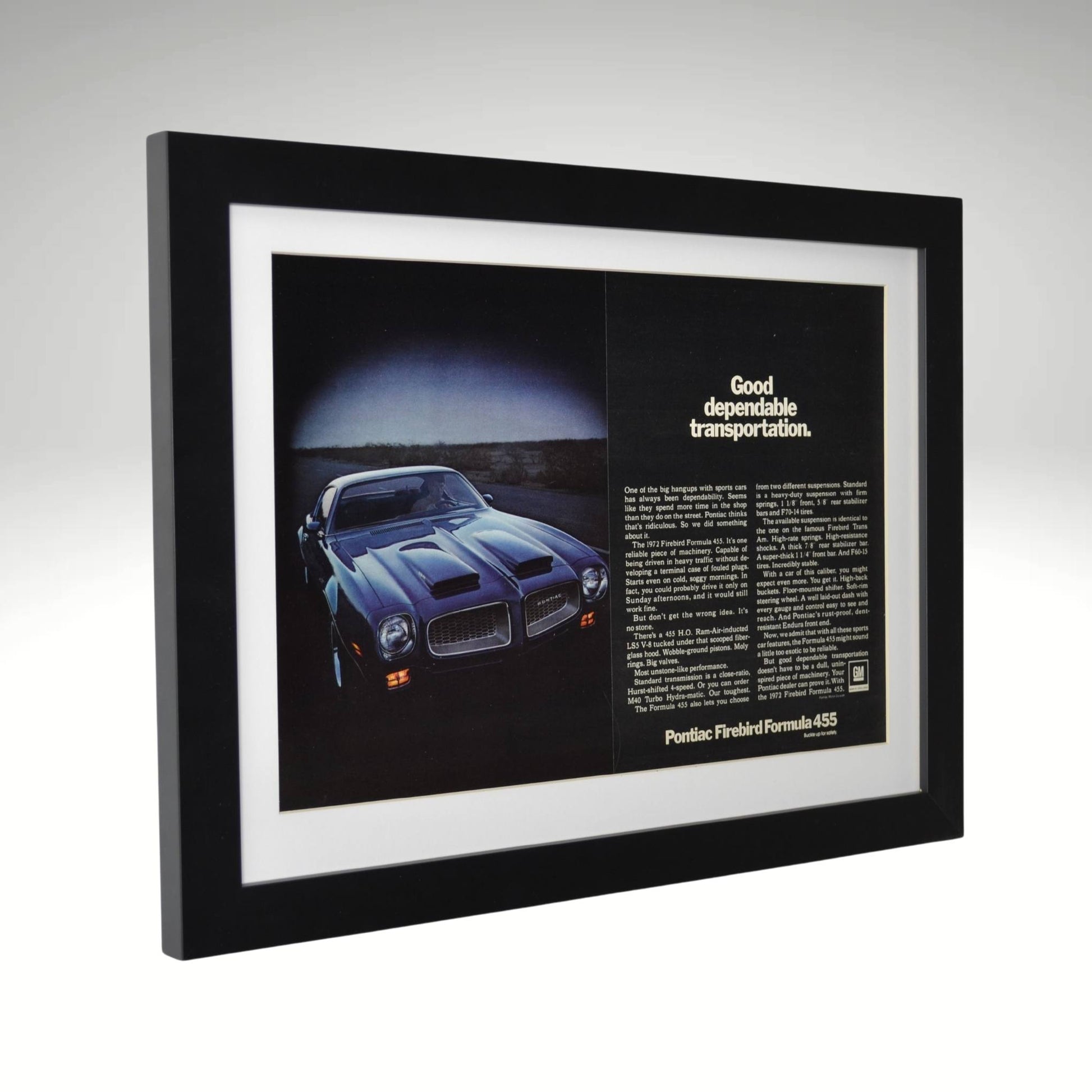 side view of black 1972 Pontiac Firebird Formula 455 framed print ad featuring the 455 HO V8, dual-scoop hood, and bold Pontiac muscle car styling.