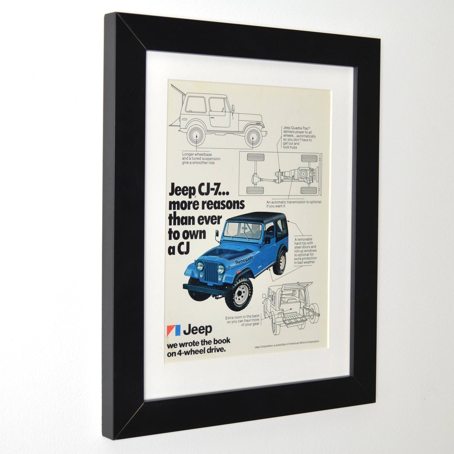 Framed side view of 1977 Jeep CJ-7 vintage print ad, featuring a blue Renegade model with technical illustrations, showcasing its 4WD system and off-road features. A perfect retro automotive poster for Jeep lovers.