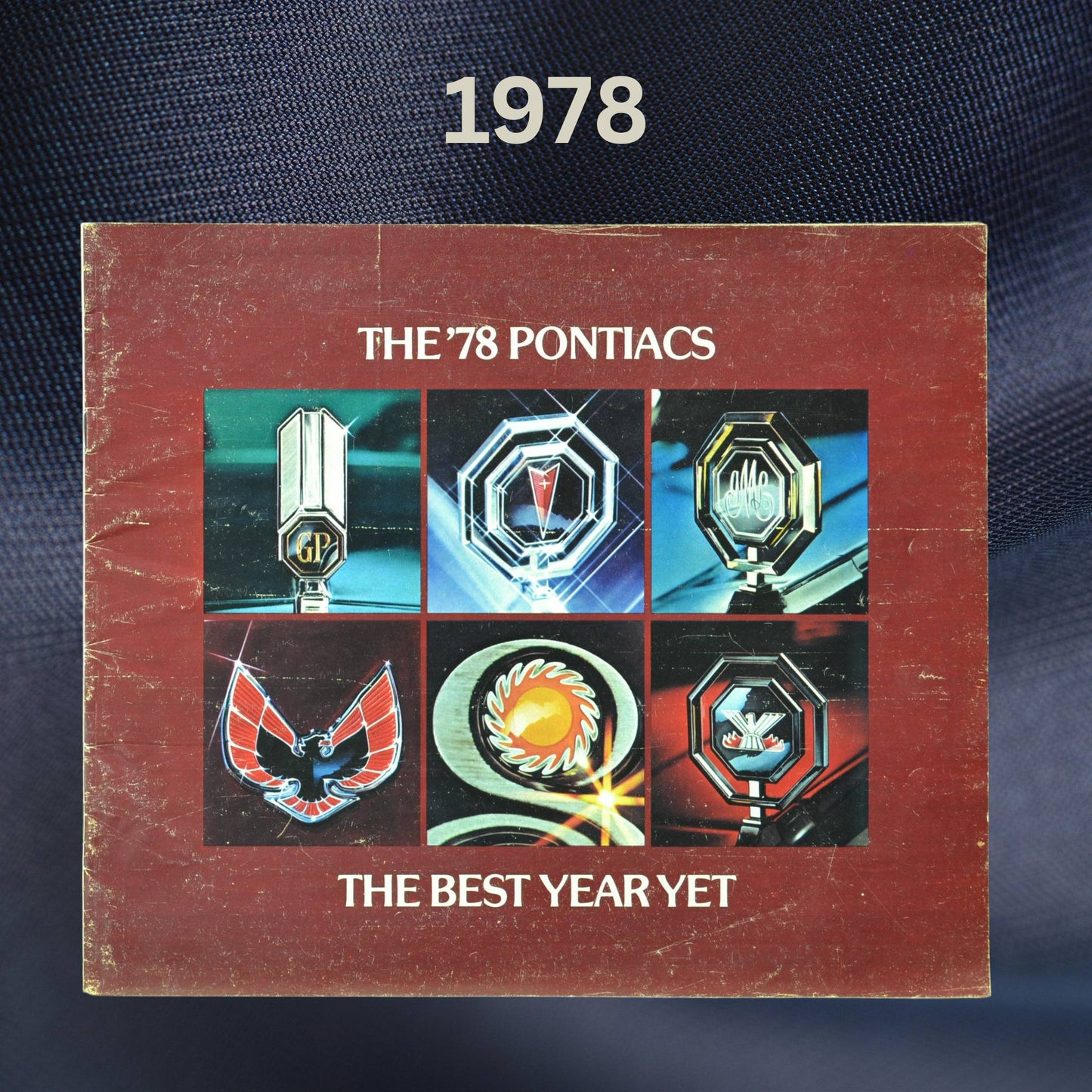 The cover of the 1978 Pontiac dealer brochure, featuring six Pontiac model emblems arranged in a grid, with the tagline "The Best Year Yet" below.