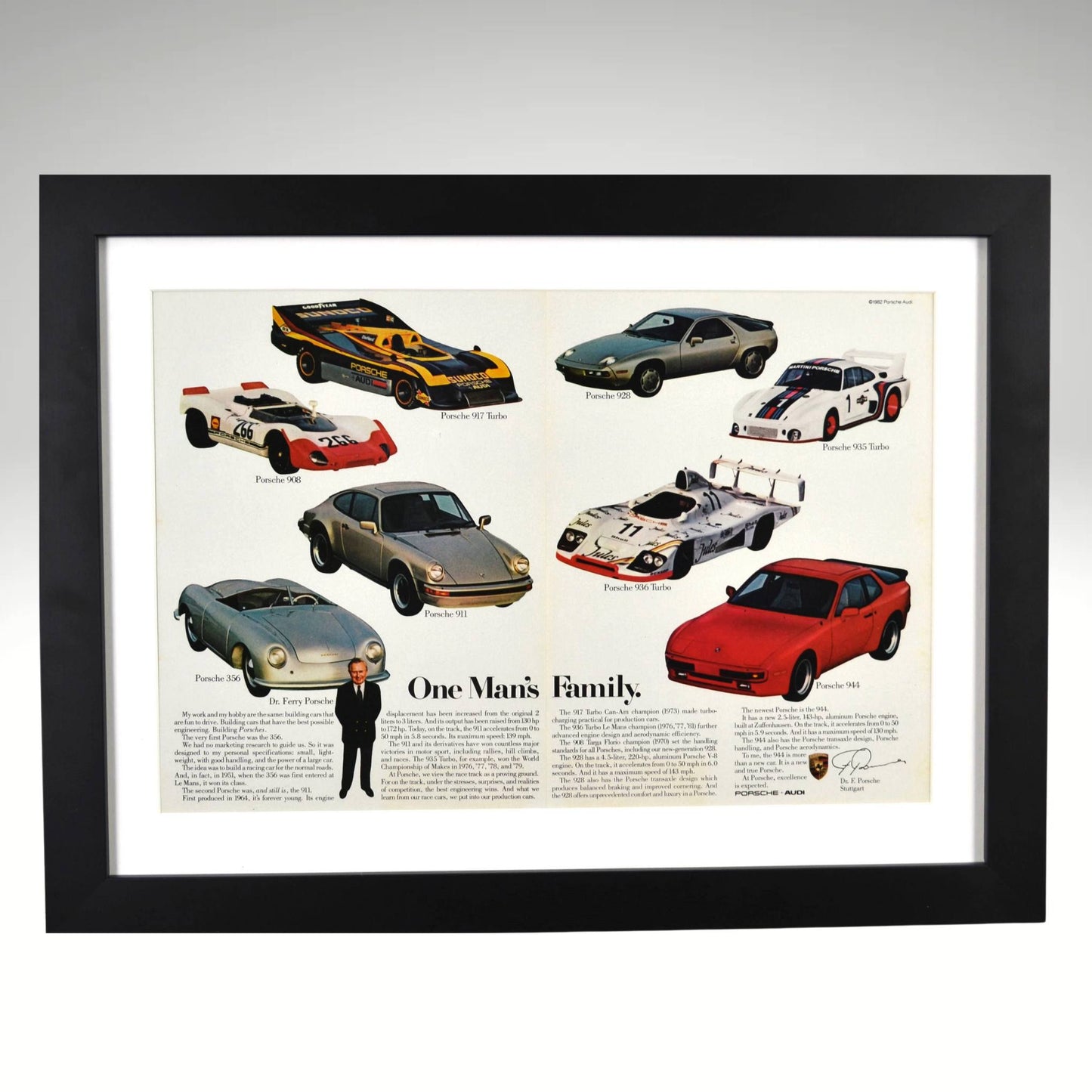 Framed 15x20 vintage Porsche print showing 1982 ad with 356, 911, 917, 928, 944, and more under the title “One Man’s Family”