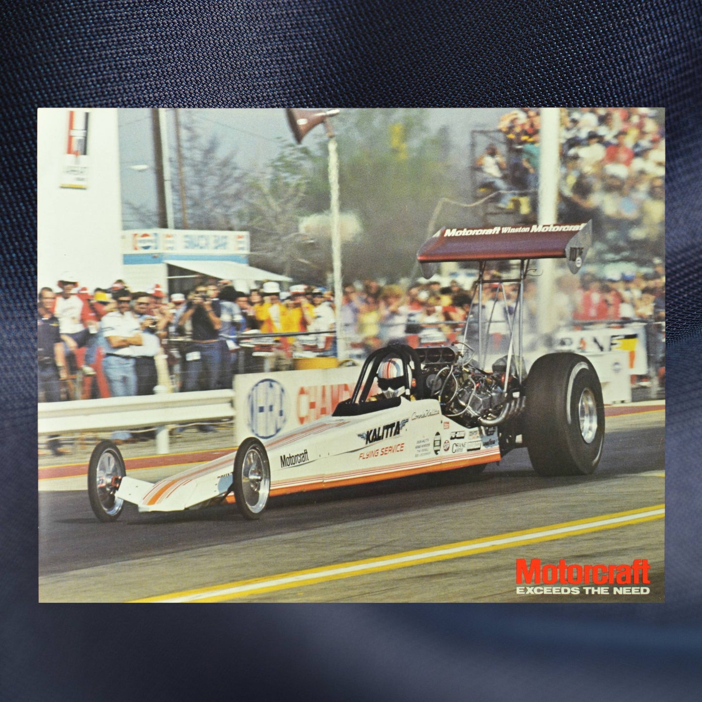 1983 Kalitta Bounty Hunter Dragster hero card showcasing the Motorcraft Top Fuel Dragster in action on the NHRA track, with a crowd in the background