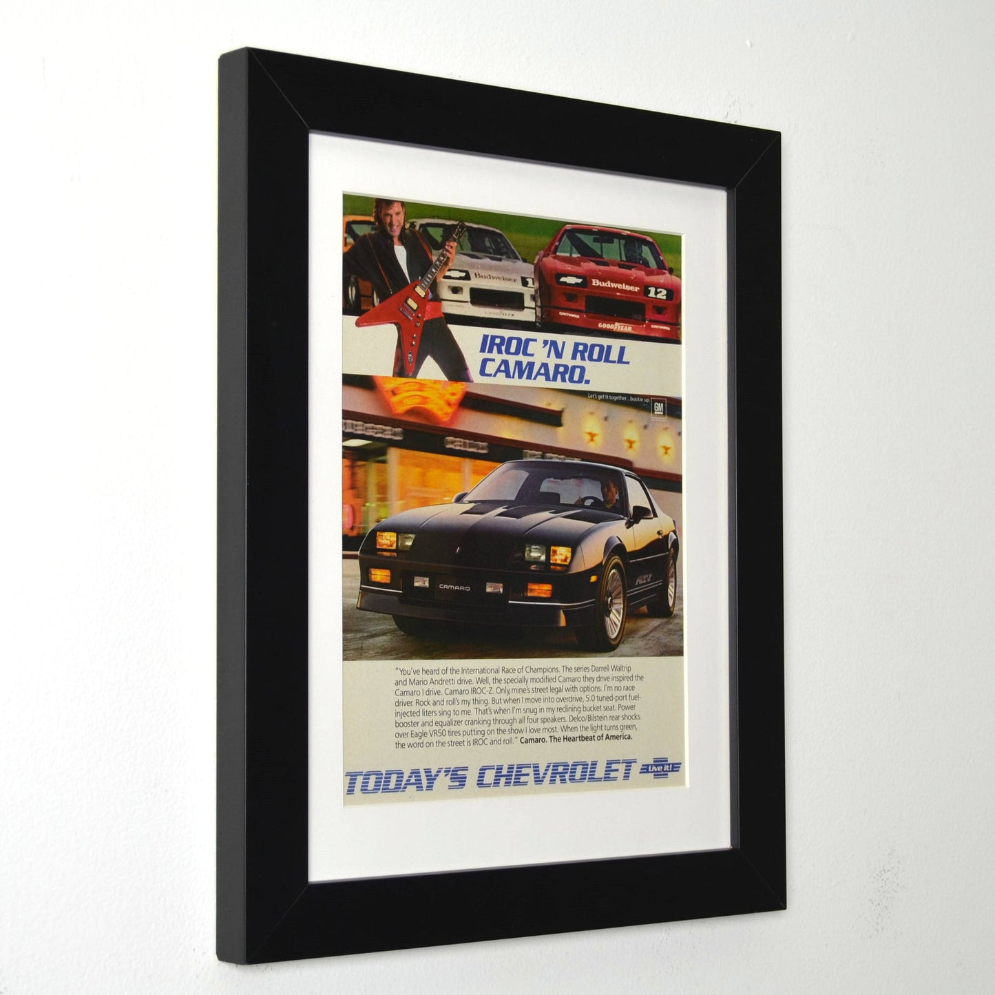 Framed advertisement for Chevrolet IROC Camaro with a black border