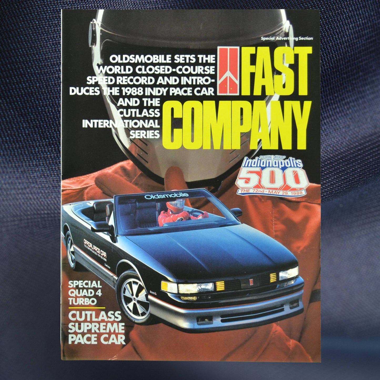1988 Oldsmobile Cutlass Supreme Indy 500 Pace Car brochure cover – Fast Company with red racing suit