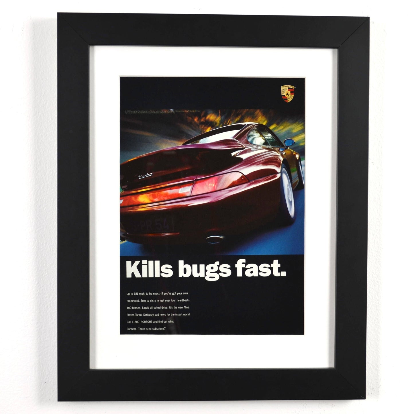 Framed 1996 Porsche 911 Turbo print ad with “Kills Bugs Fast” headline – vintage automotive wall art with new frame, mat, and glass