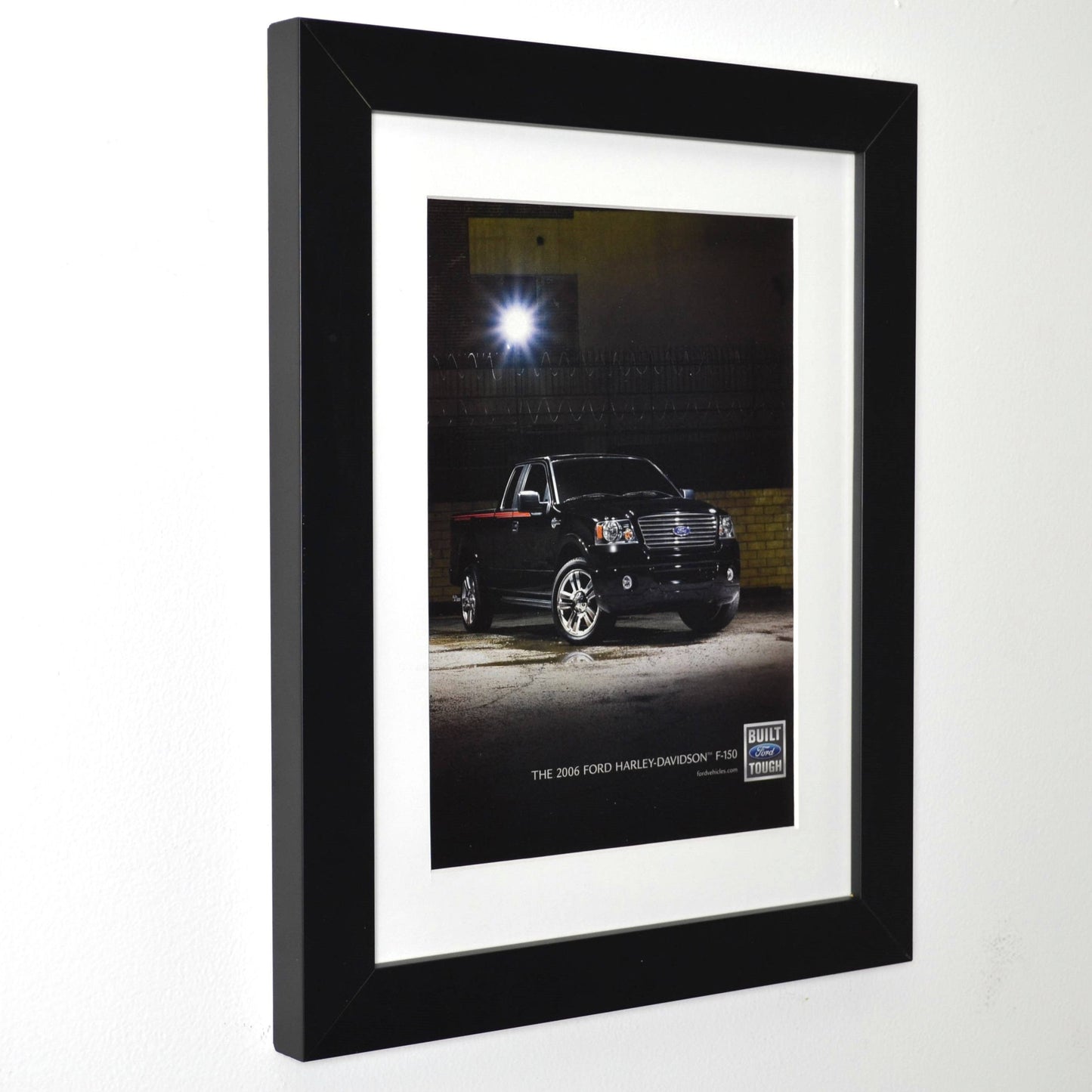 Framed 2006 Ford Harley-Davidson F-150 ad with black truck at night – 12x15 vintage print side view