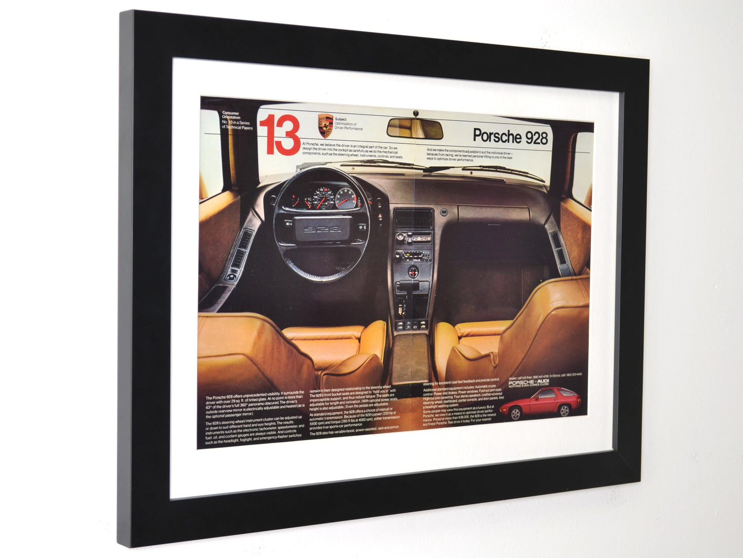 Framed Porsche 928 vintage ad featuring 1980s interior and dashboard side view