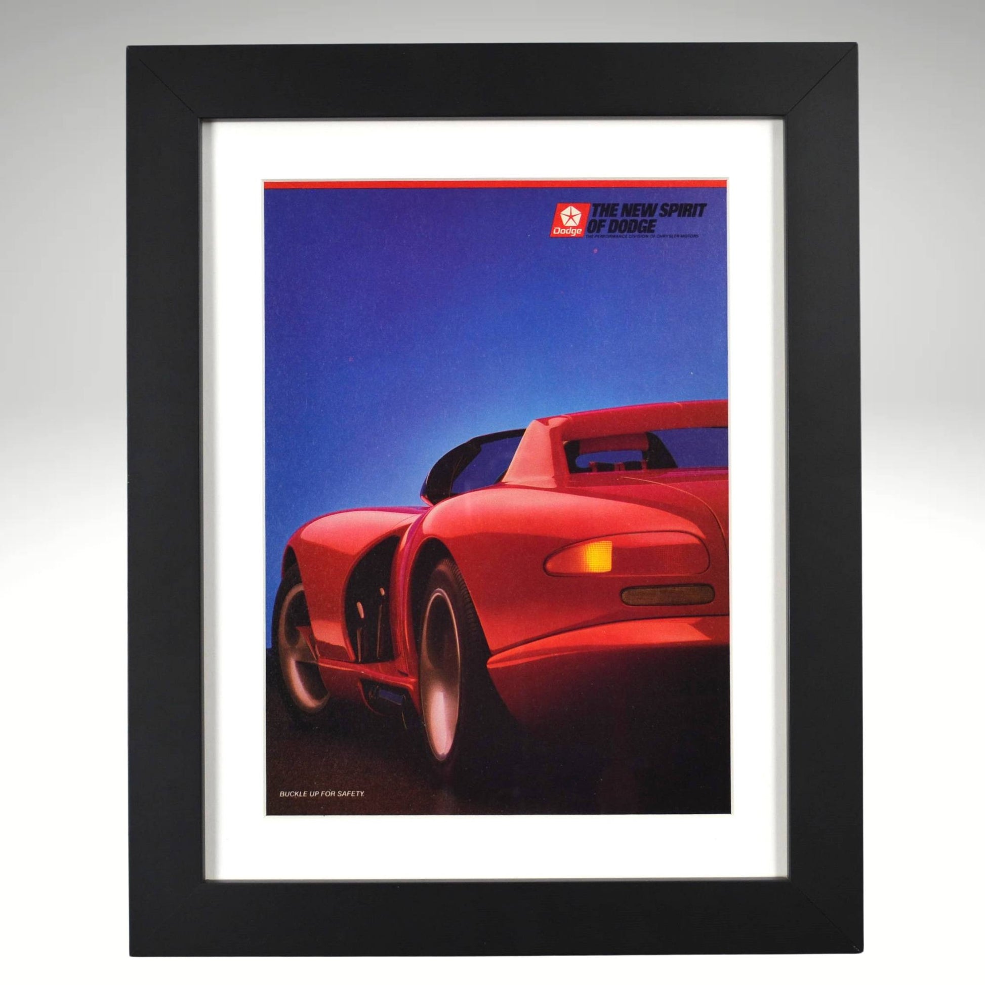 Framed poster of a red Viper sports car against a blue sky with 'Dodge' branding.