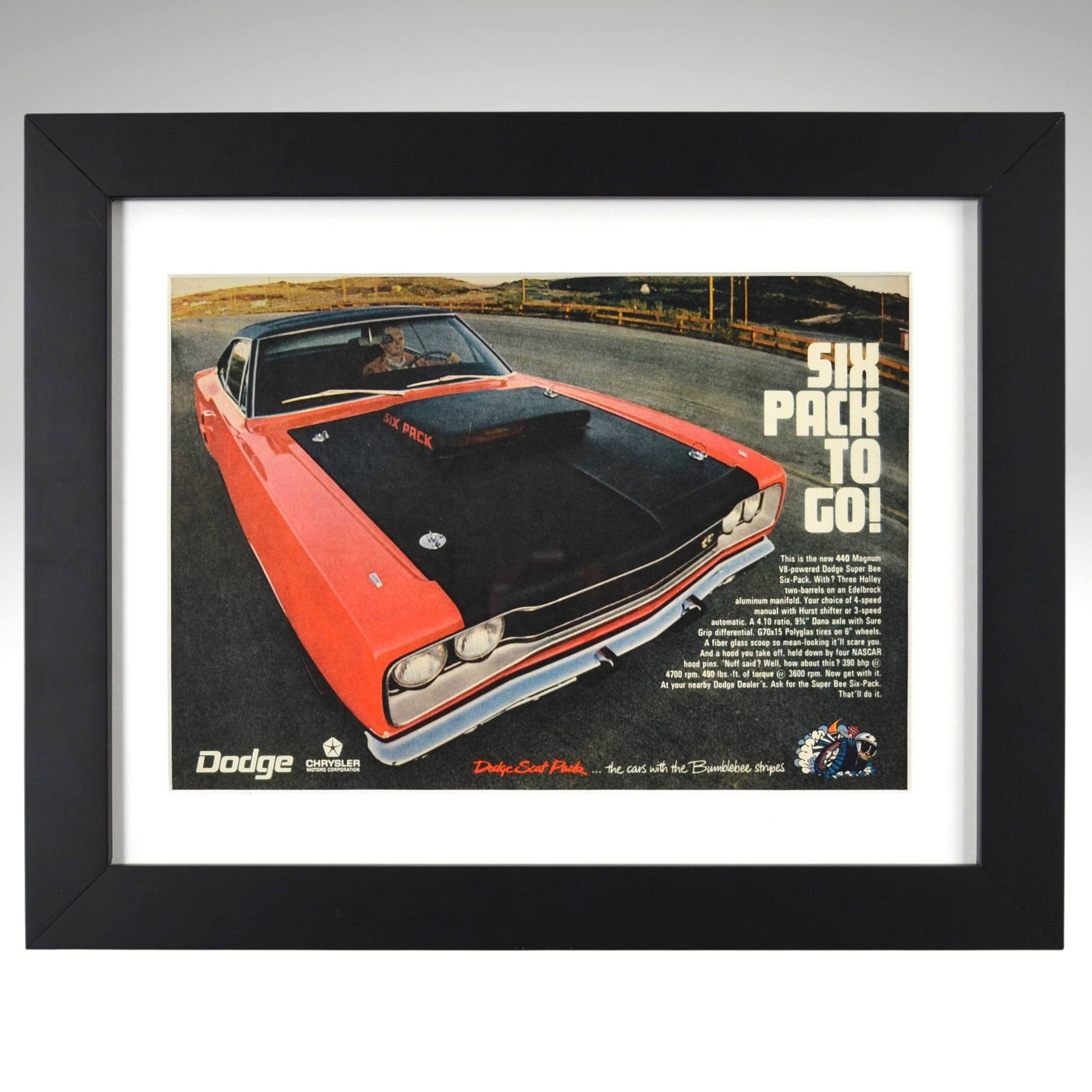 Framed 1970 Dodge Super Bee 440 Six Pack vintage print ad featuring an orange Super Bee with matte black Six Pack hood and “Six Pack to Go!” slogan — authentic Mopar wall art for collectors and enthusiasts