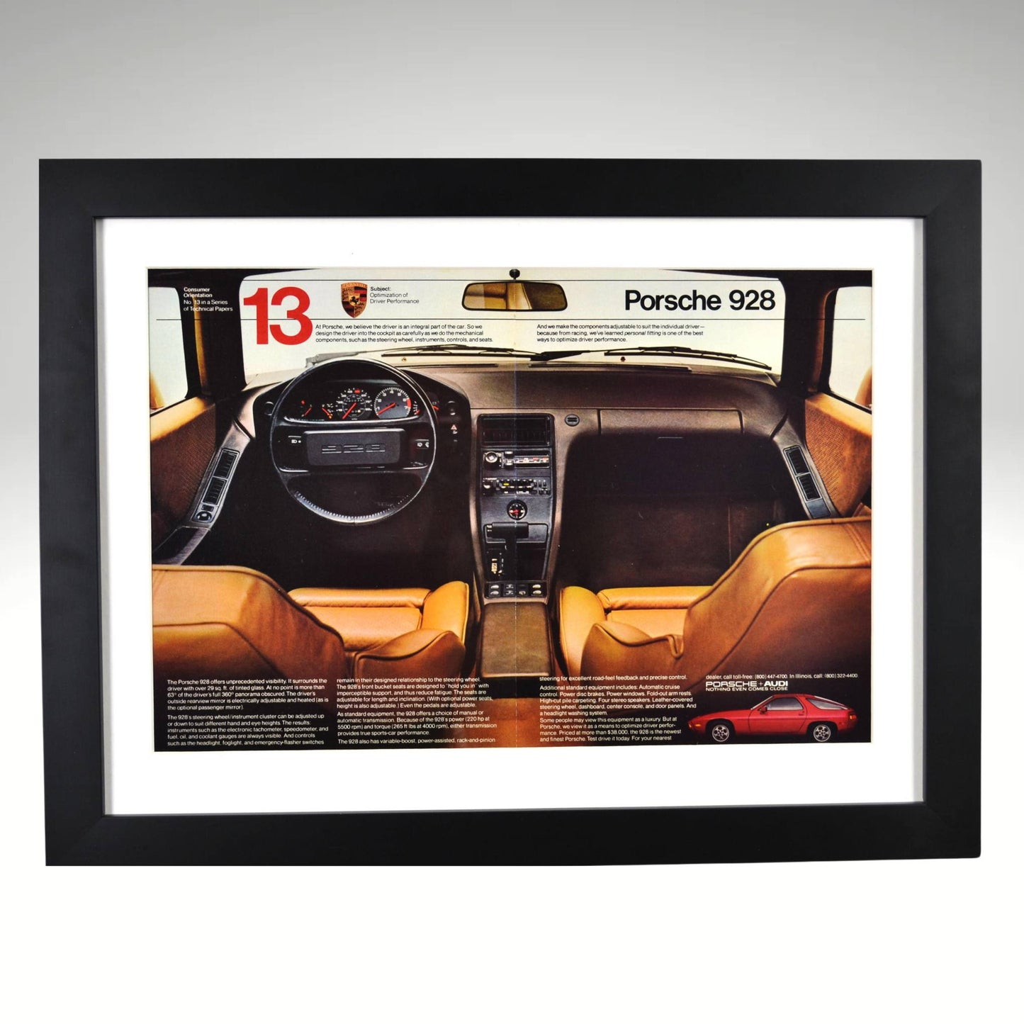 Framed Porsche 928 vintage ad featuring 1980s interior and dashboard