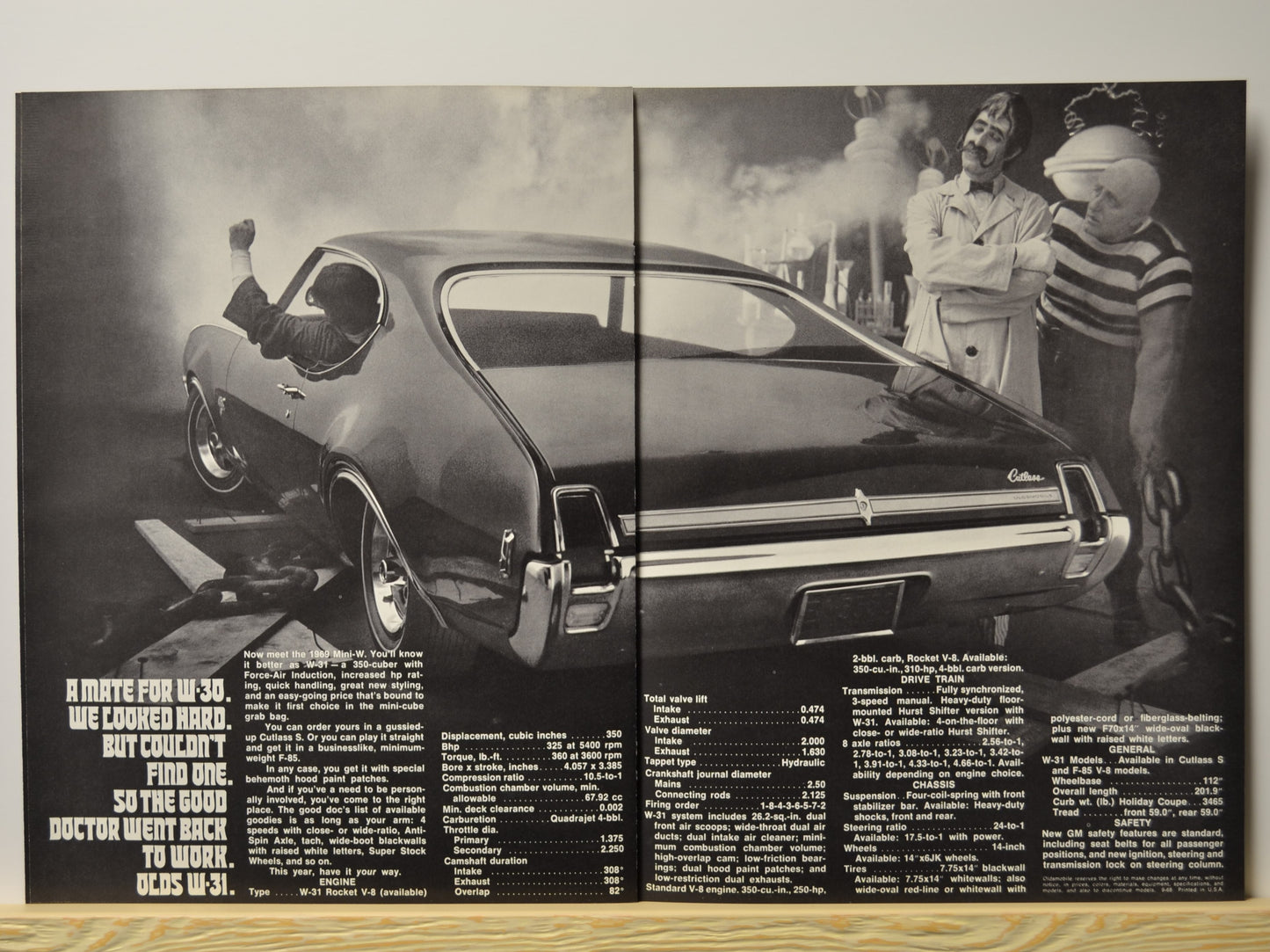Rear angle view of W-31 Cutlass with Dr. Olds looking on