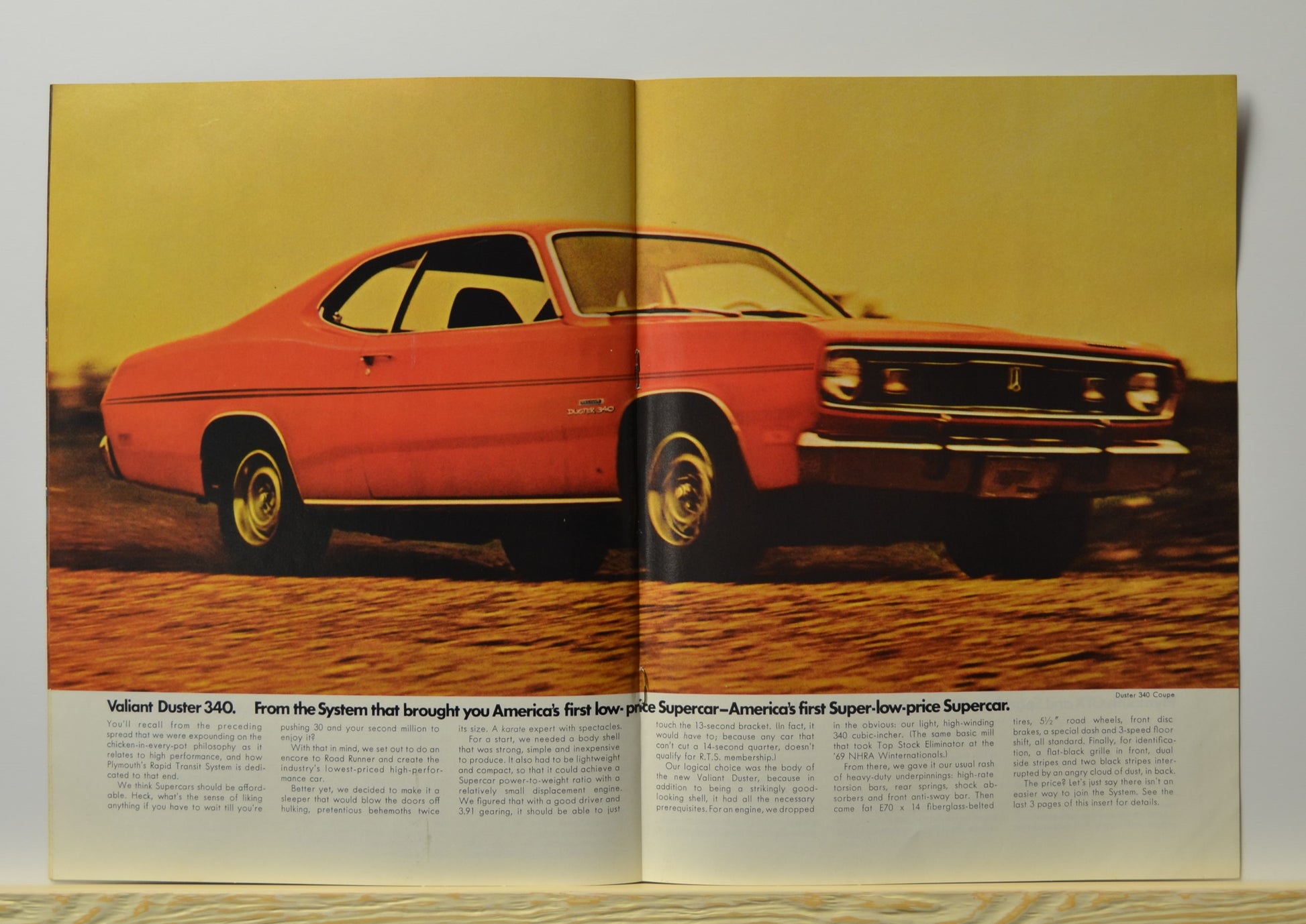 Red 1970 Duster 340 shown in motion with performance text