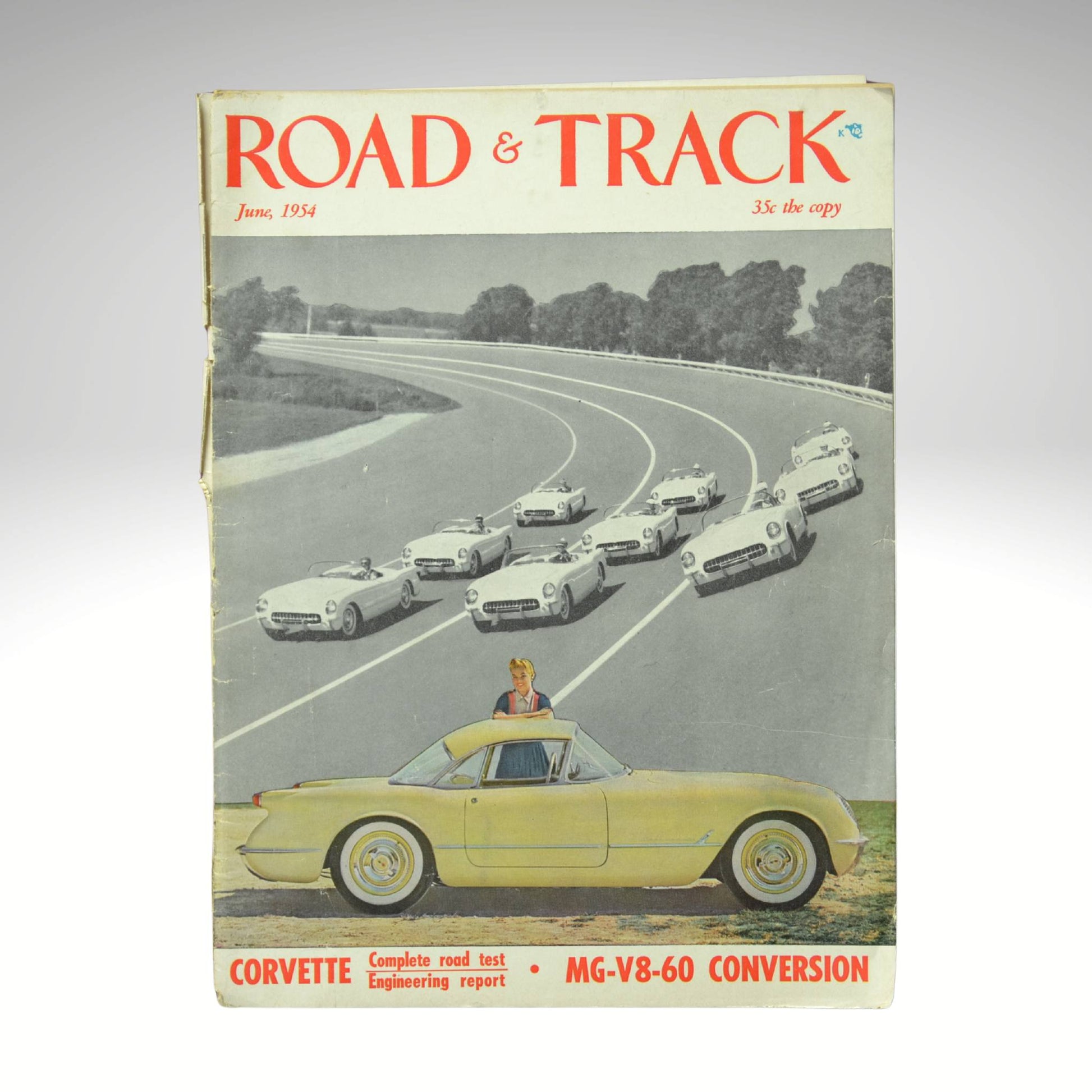 Vintage 'Road & Track' magazine cover with a yellow 1954 Corvette 