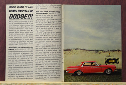 Inside pages of the 1962 Dodge Dart 440 sales brochure, showcasing a red Dodge Dart coupe on an open road with detailed performance specs