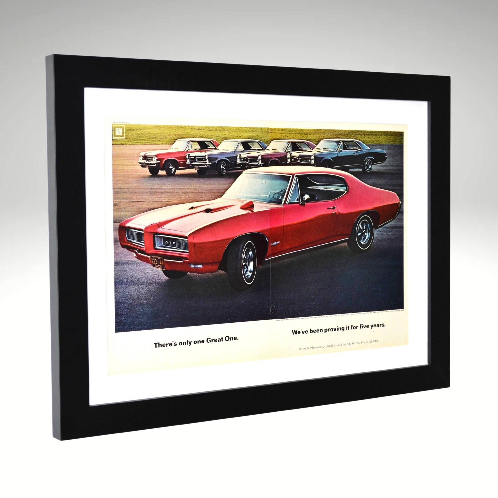 Framed 1968 Pontiac GTO ad featuring 1964–1968 lineup and “Great One” slogan side view

