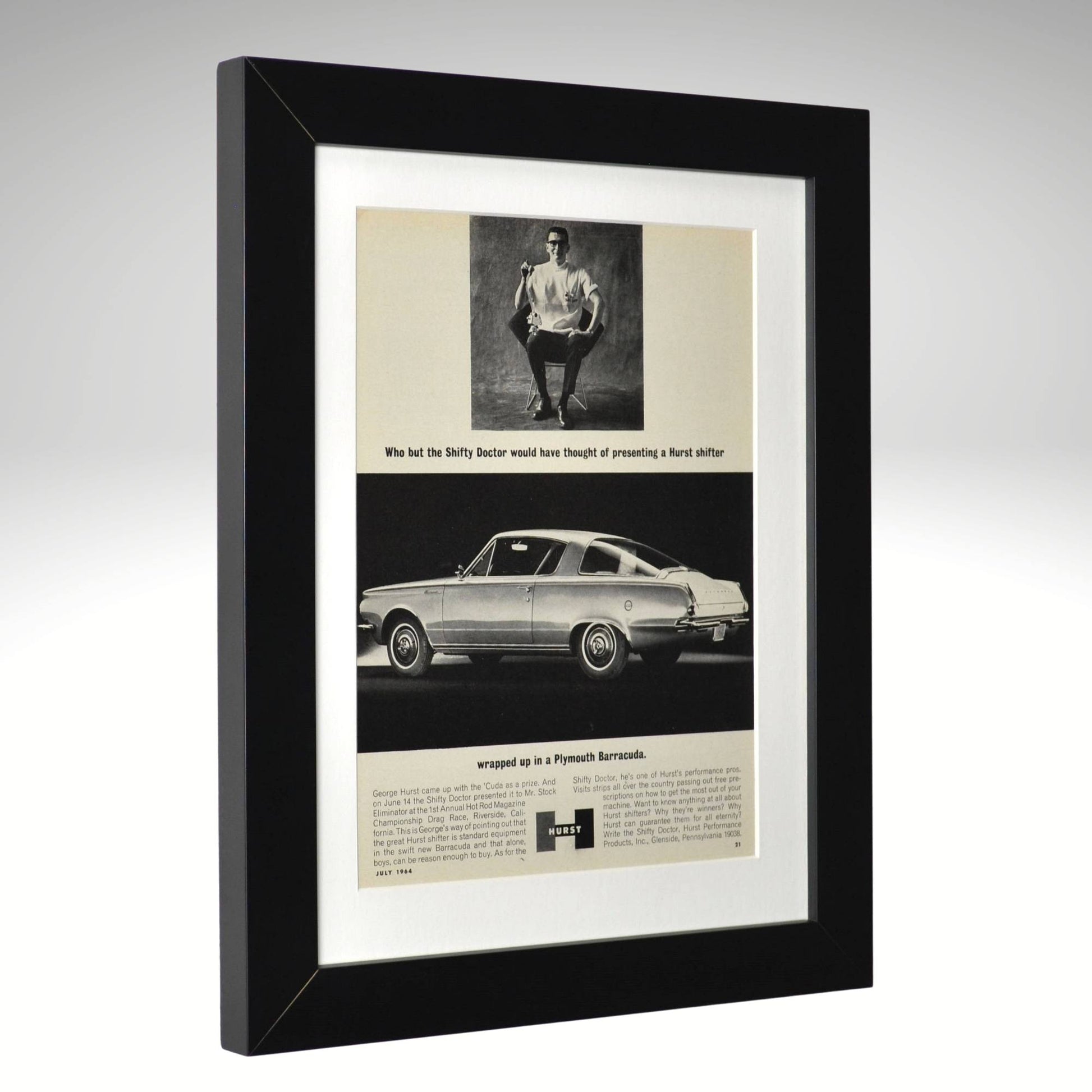 Framed vintage advertisement for a Plymouth Barracuda car with a black border.