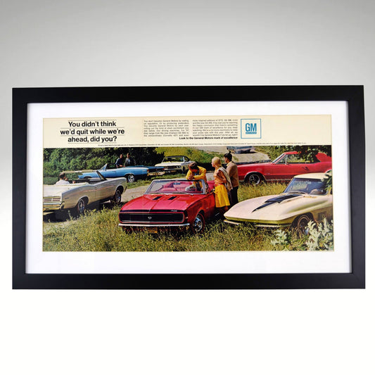 1967 GM Muscle Car Lineup – Framed 15x24 Vintage Automotive Print featuring a red Camaro SS, Corvette, Pontiac GTO, and other muscle cars in a scenic field, professionally framed for car enthusiasts.

