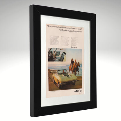 A framed vintage Chevrolet Corvette advertisement print with a black frame and white mat, shown at a slight angle against a neutral gray background.