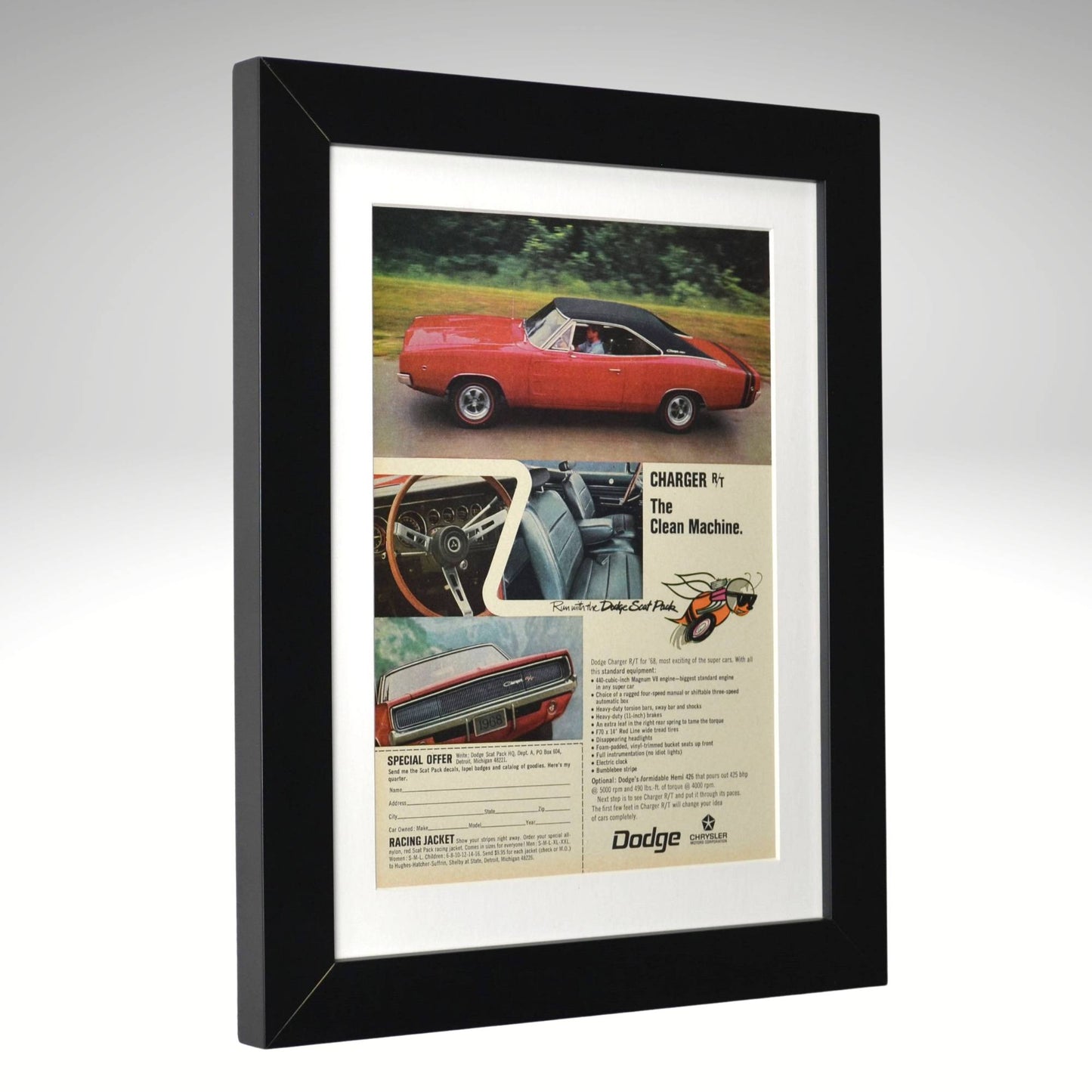 Framed Dodge advertisement with a red car on a gray background