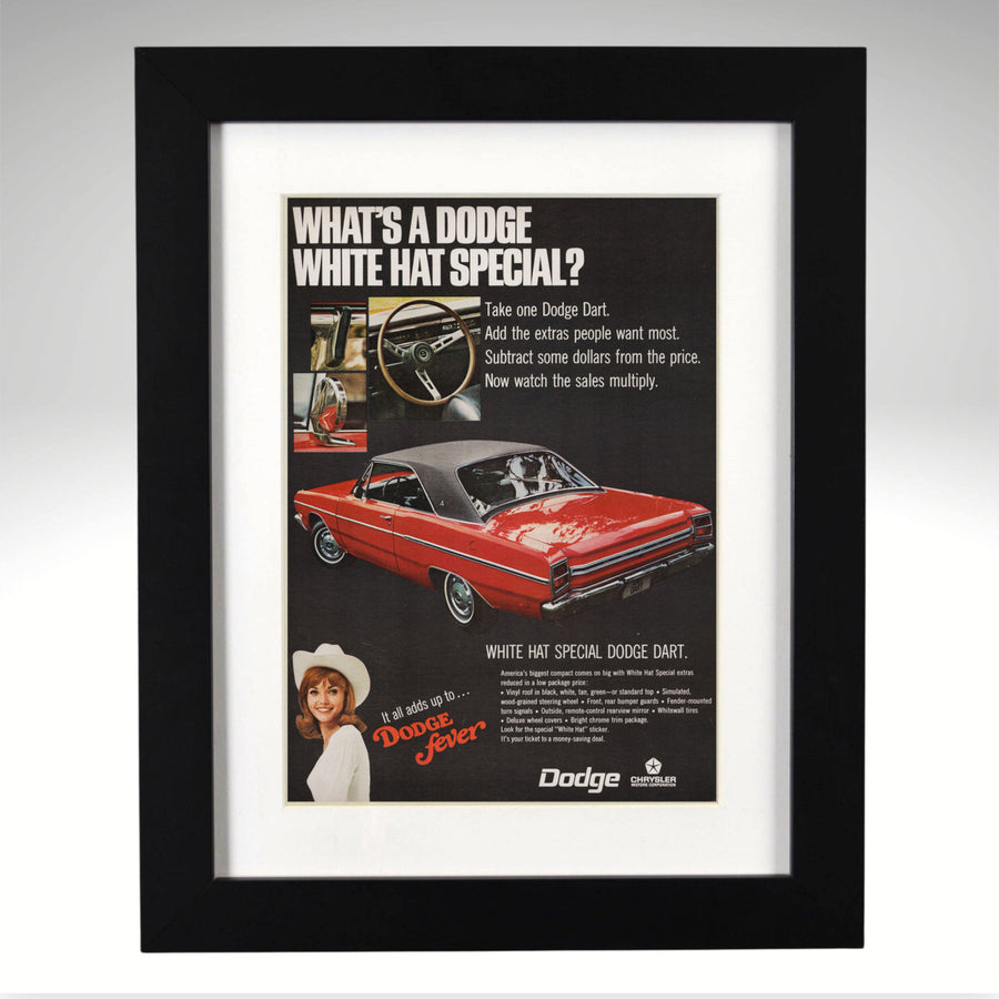 Framed Dodge Dart advertisement with a red car on a black background