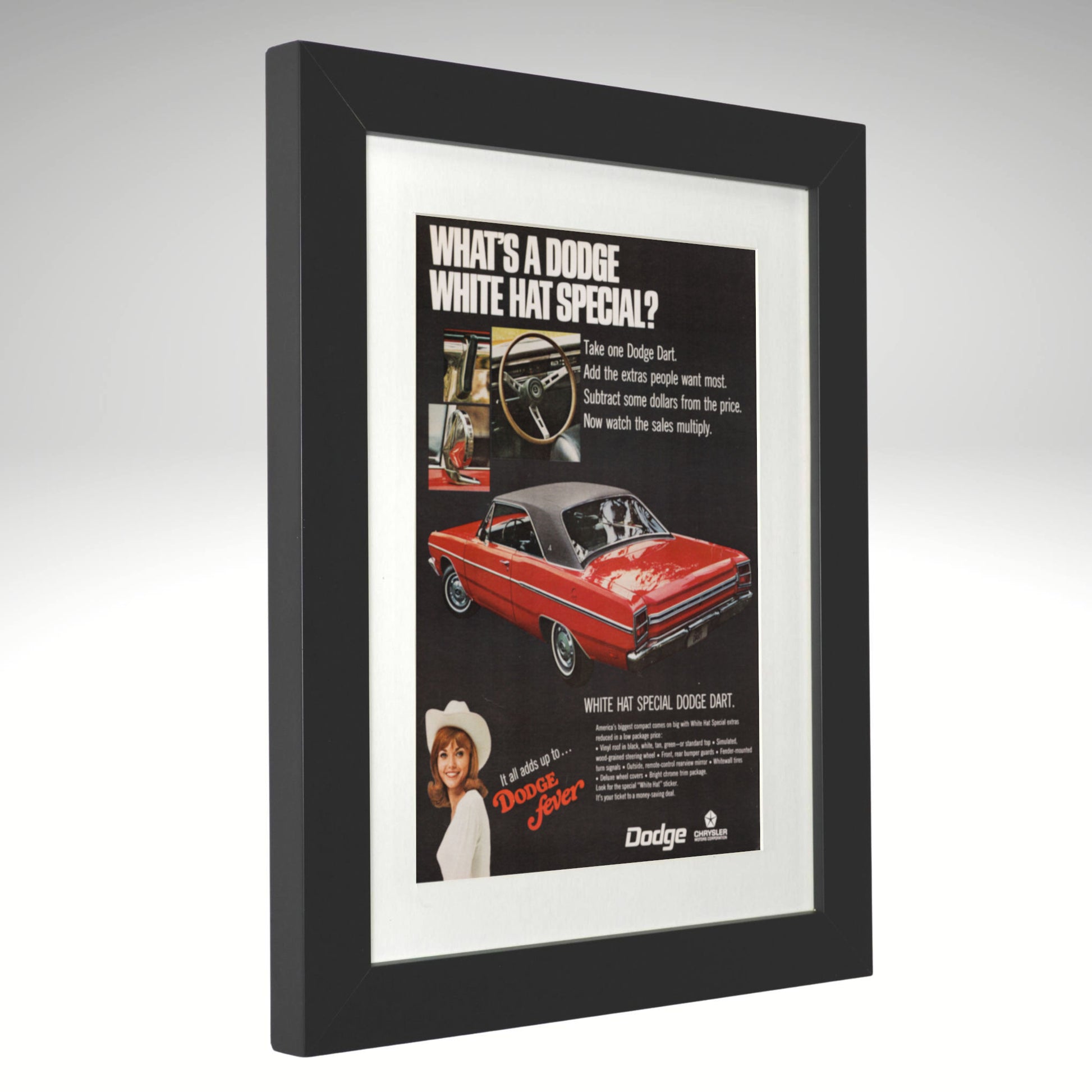 Framed 1969 Dodge advertisement with a red car on a white background