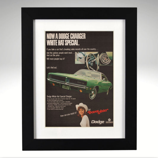 Framed 1969 Dodge Charger advertisement with a green car and text on a gray background