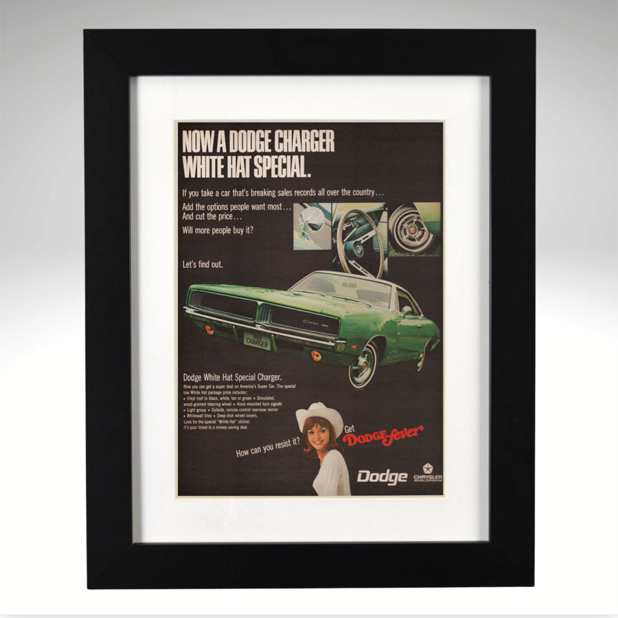 Framed 1969 Dodge Charger advertisement with a green car and text on a gray background