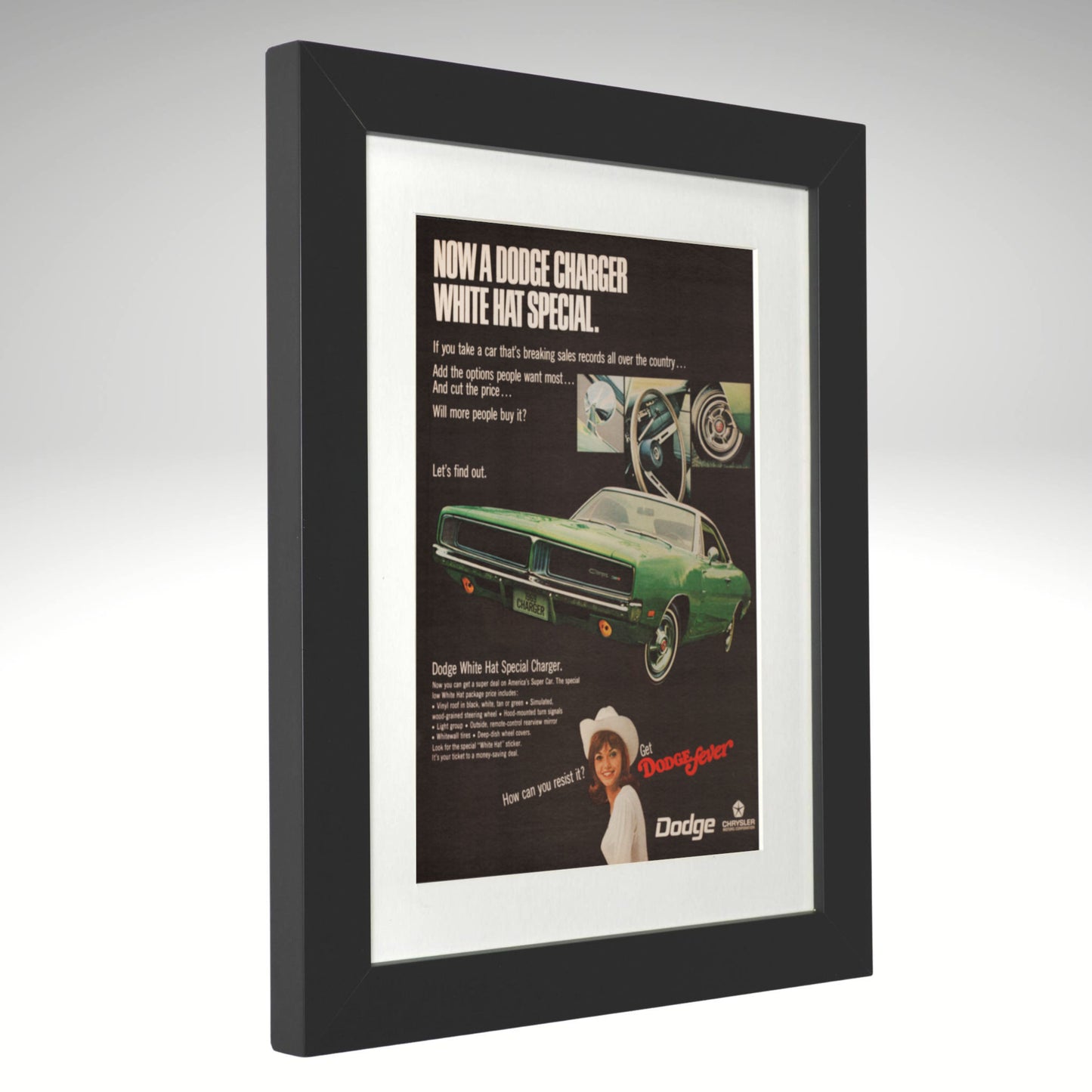 Framed vintage Dodge Charger advertisement on a white background