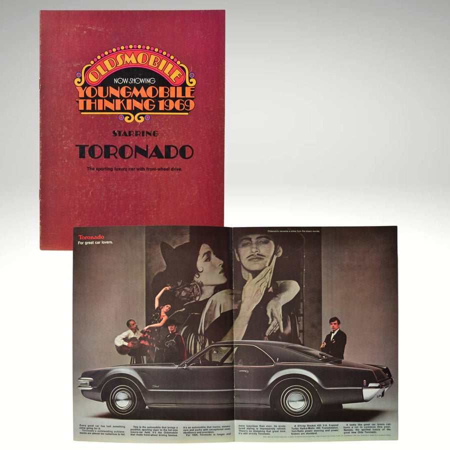 1969 Oldsmobile Toronado brochure cover with "Youngmobile Thinking" design and side profile with flamenco scene and promotional text