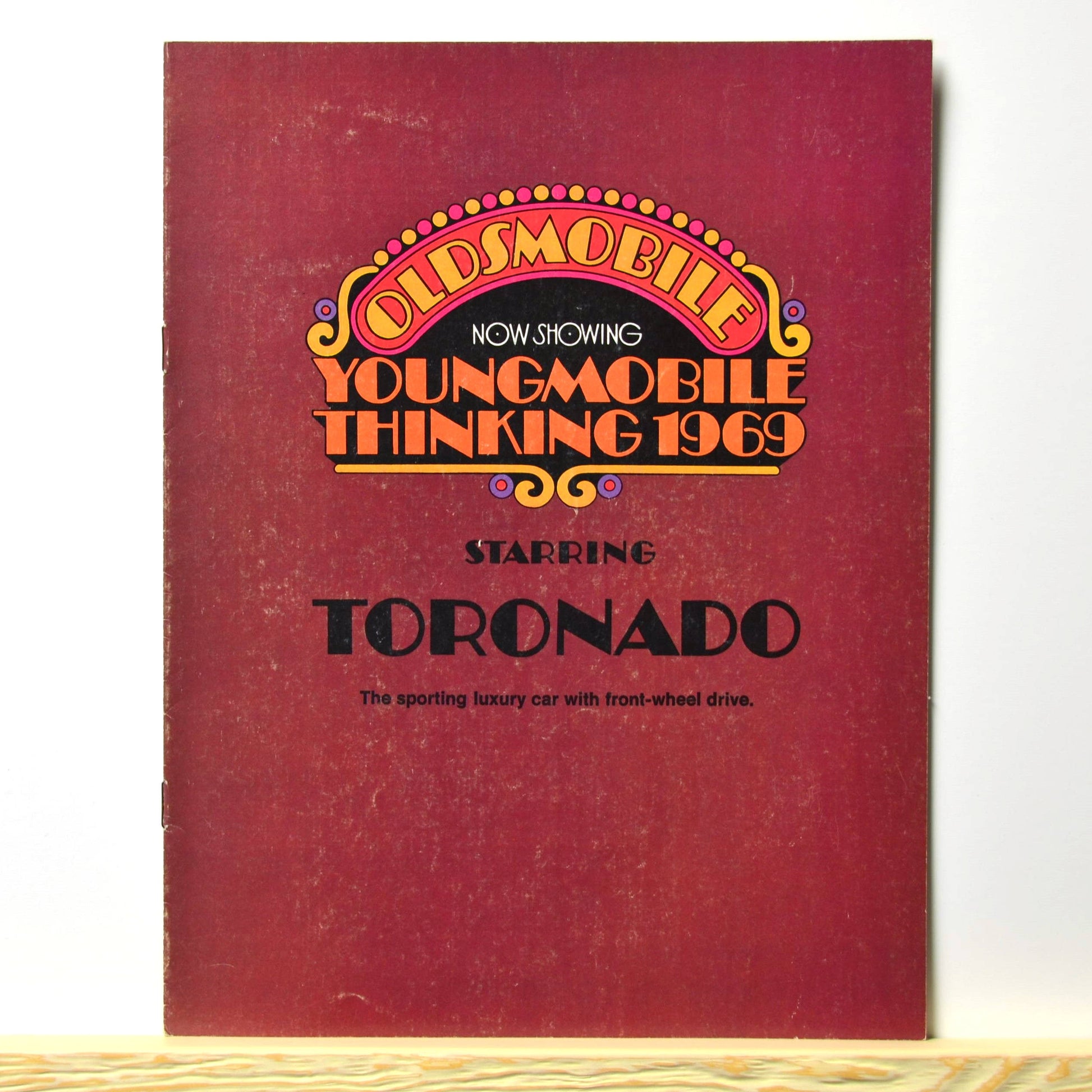 1969 Oldsmobile Toronado brochure cover with "Youngmobile Thinking" design 