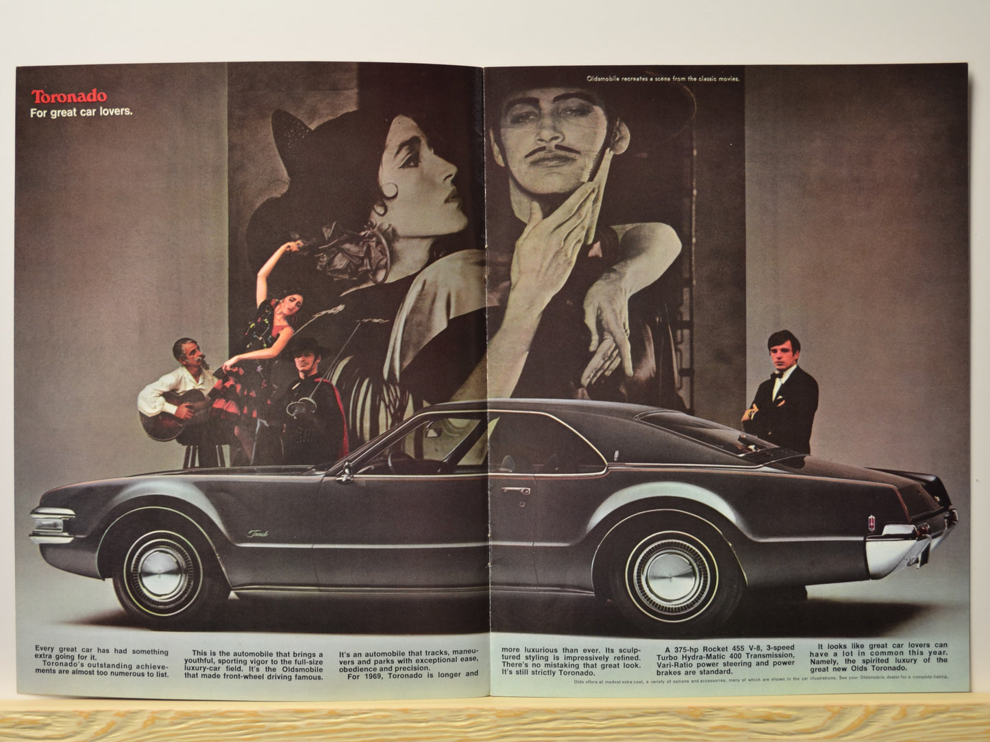 1969 Toronado side profile with flamenco scene and promotional text