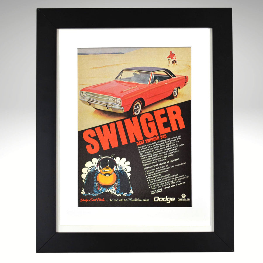 Framed 1969 Dodge Dart Swinger 340 vintage print ad featuring a red Swinger on a beach with bold “SWINGER” headline and Scat Pack bumblebee logo—authentic Mopar wall art for collectors.