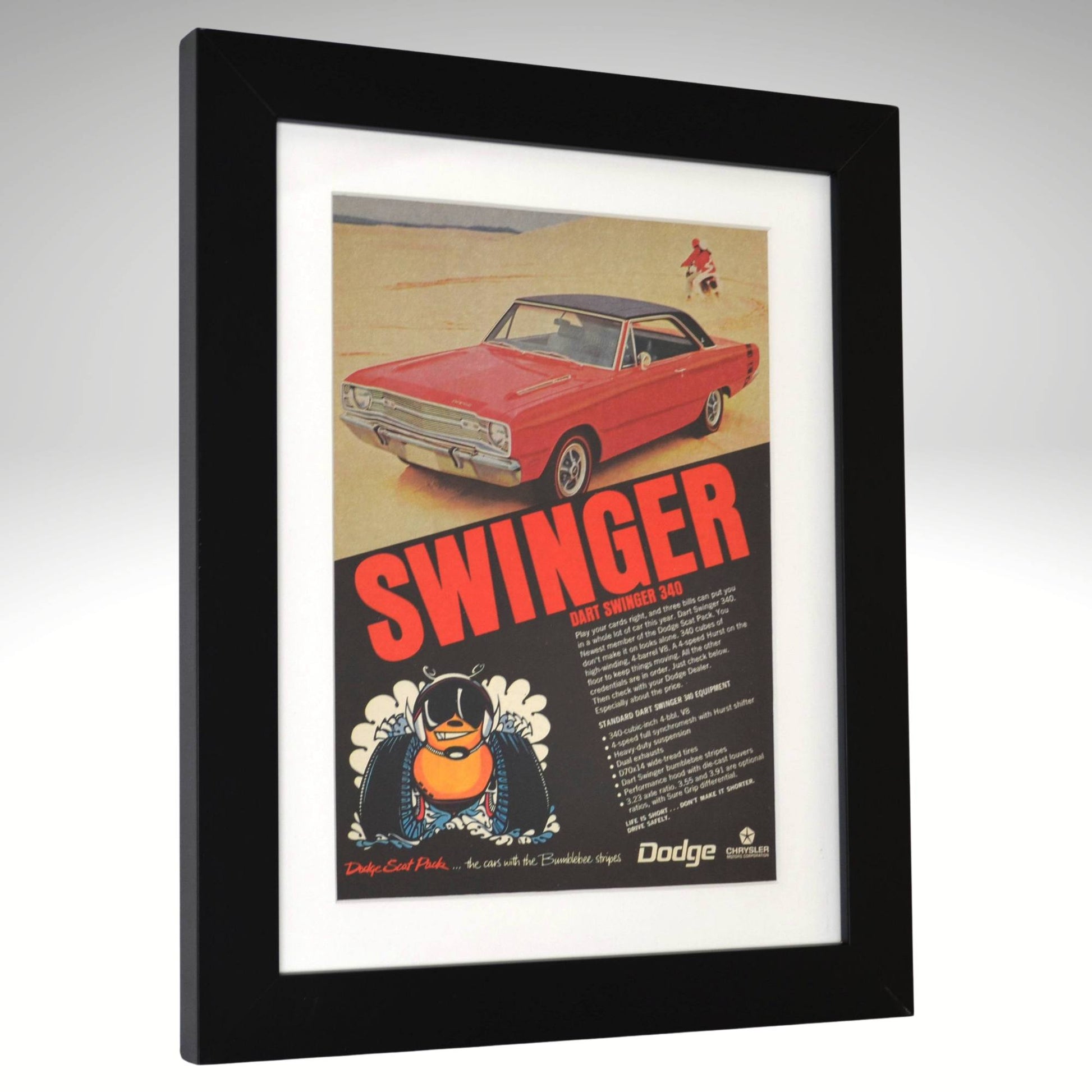 Framed 1969 Dodge Dart Swinger 340 vintage print ad featuring a red Swinger on a beach with bold “SWINGER” headline and Scat Pack bumblebee logo—authentic Mopar wall art for collectors side view