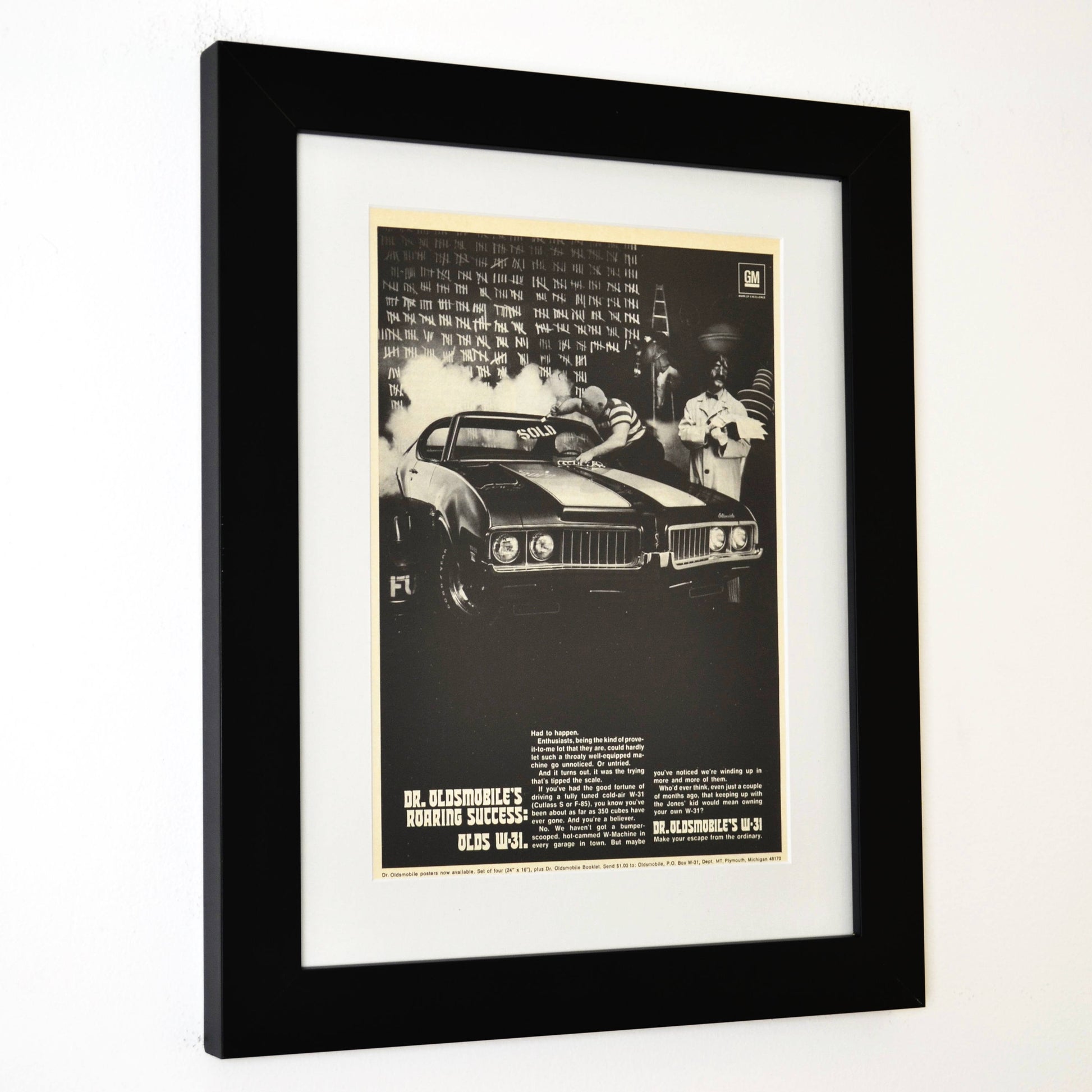 Framed 1969 Oldsmobile W-31 ad featuring Dr. Oldsmobile and burnout scene from the “Roaring Success” campaign side view