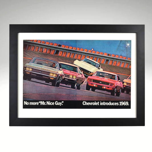 Framed 1969 Chevrolet ad with Impala SS, Camaro SS, Chevelle SS, Nova SS, and Corvette on test track