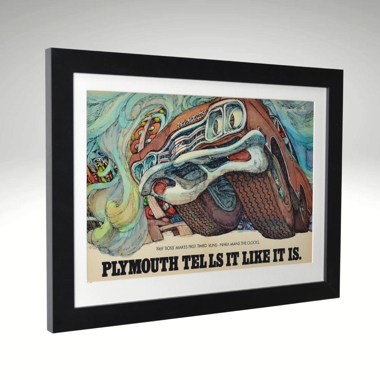 Side view of 1969 Plymouth GTX framed vintage print ad featuring bold drag racing art and colorful design, 15" x 20" dimensions.

