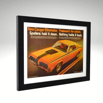 Framed Orange 1970 Mercury Cougar Eliminator vintage ad featuring a bold orange muscle car design with the slogan "Password for action," protected by glass and ready to hang.

