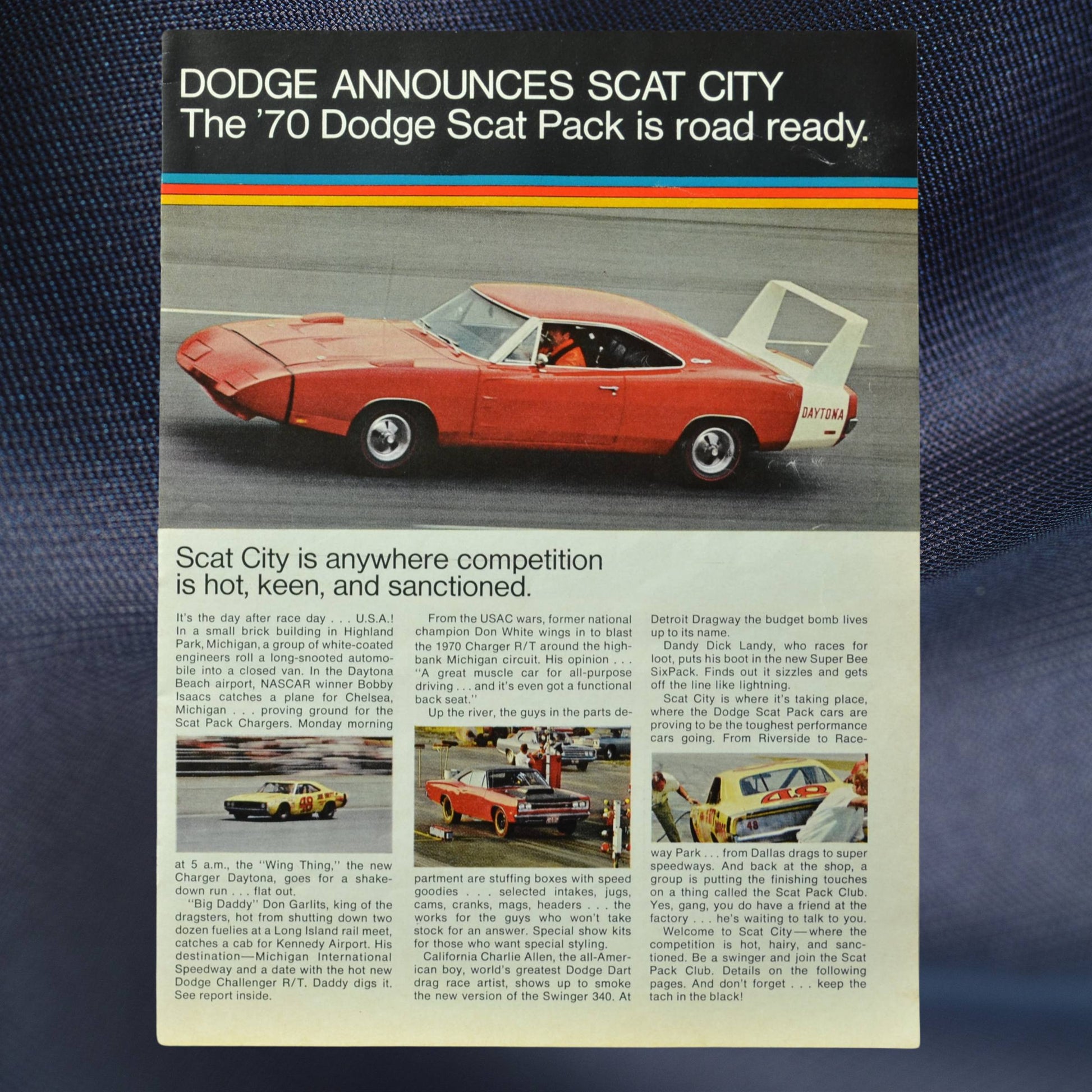 1970 Dodge Scat Pack sales brochure cover featuring a bright red Charger Daytona on the track.