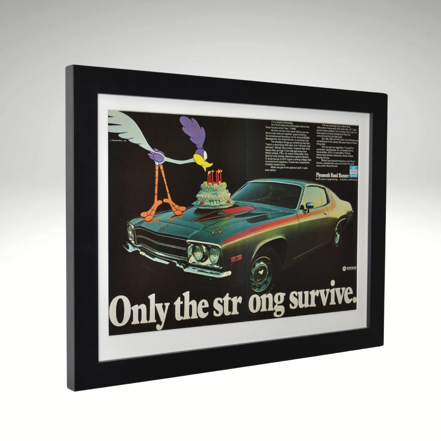 side view of 1973 Plymouth Road Runner framed vintage print ad with Road Runner cartoon and "Only the Strong Survive" slogan, 15" x 20"