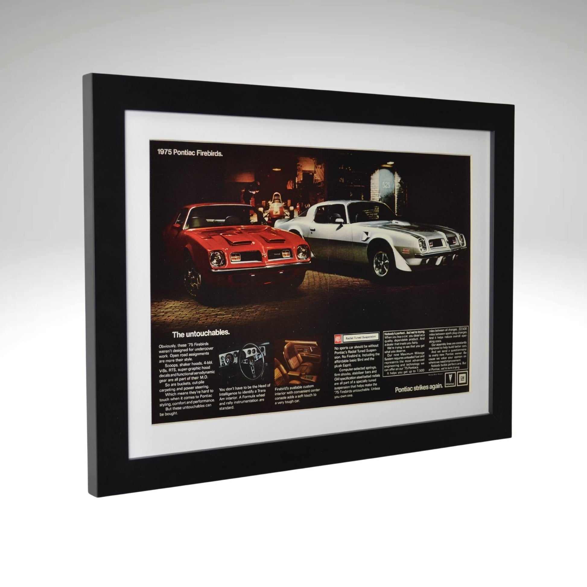 side view of red and grey 1975 Pontiac Firebird Trans Am & Formula framed print ad featuring the 455 HO V8, Firebird Formula styling, and classic muscle car design.

