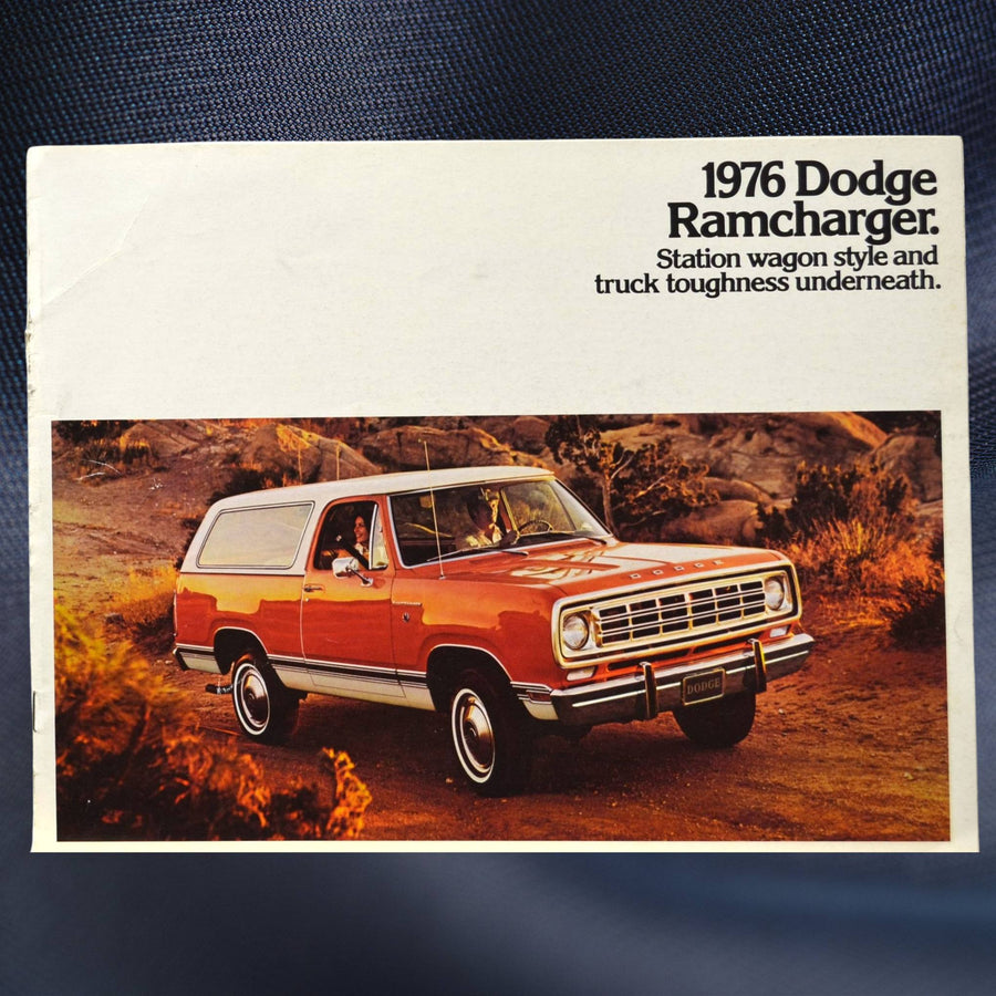 Front cover of the 1976 Dodge Ramcharger brochure showing orange SUV on rugged trail