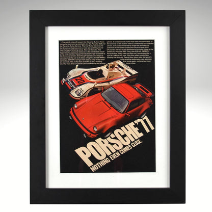 Framed 1977 Porsche Turbo vintage print ad featuring a red 911 Turbo and Porsche 936 race car with bold text reading “Nothing Even Comes Close.” Displayed in a matte black frame with white mat—perfect automotive wall art for collectors.
